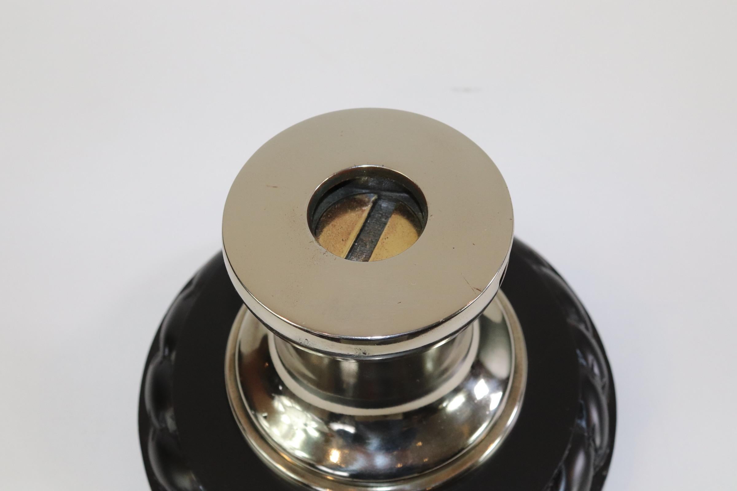 Polished and lacquered brass yacht winch mounted onto a custom wood base with rope carved border. Weight is 15 pounds.