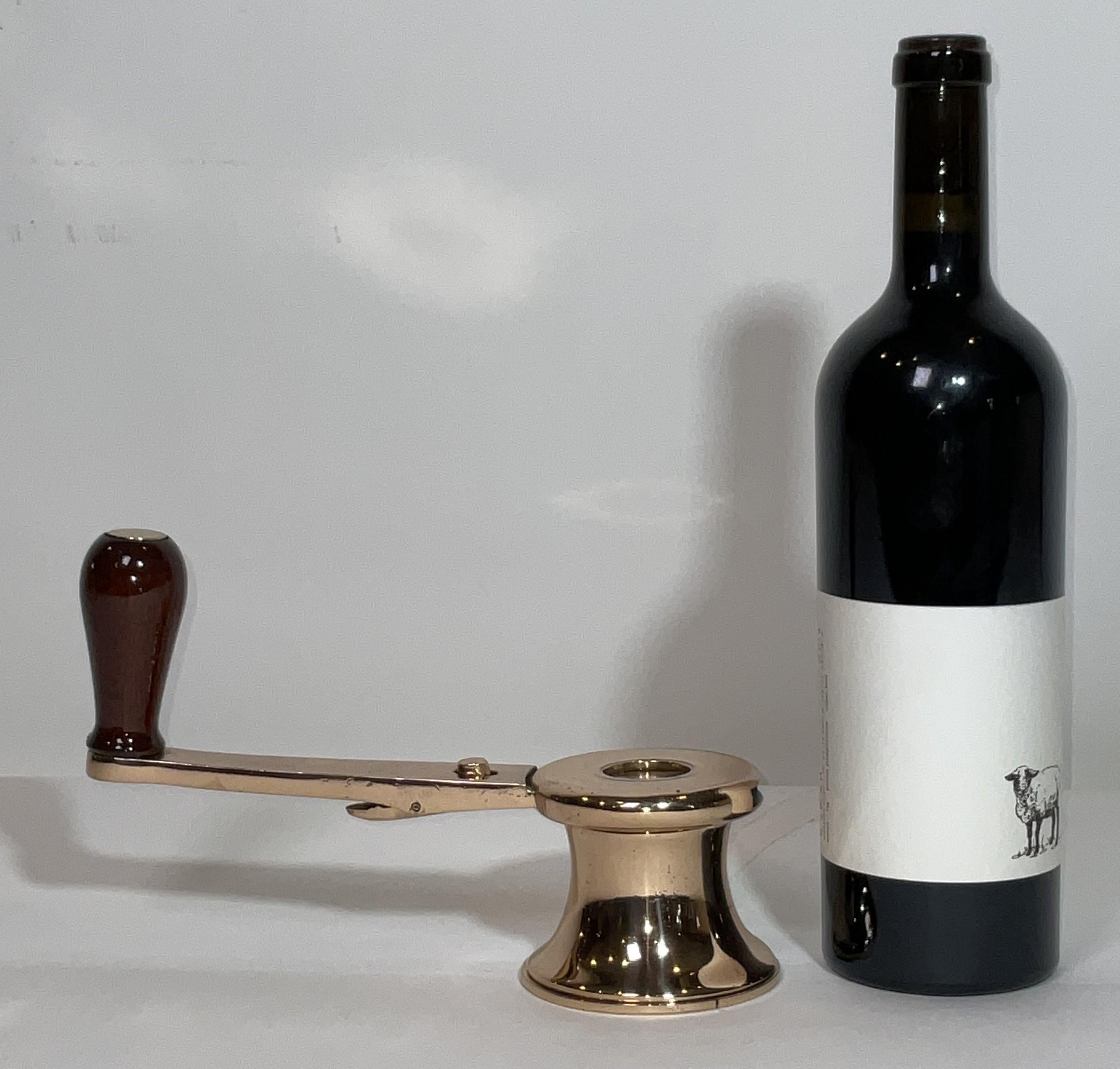 Geared yacht winch with handle. Highly polished and lacquered. Varnished handle with a varnished wood grip. This is a line tensioner winch. Fine yachting relic.

Weight:    3 lbs.
Overall Dimensions:    6