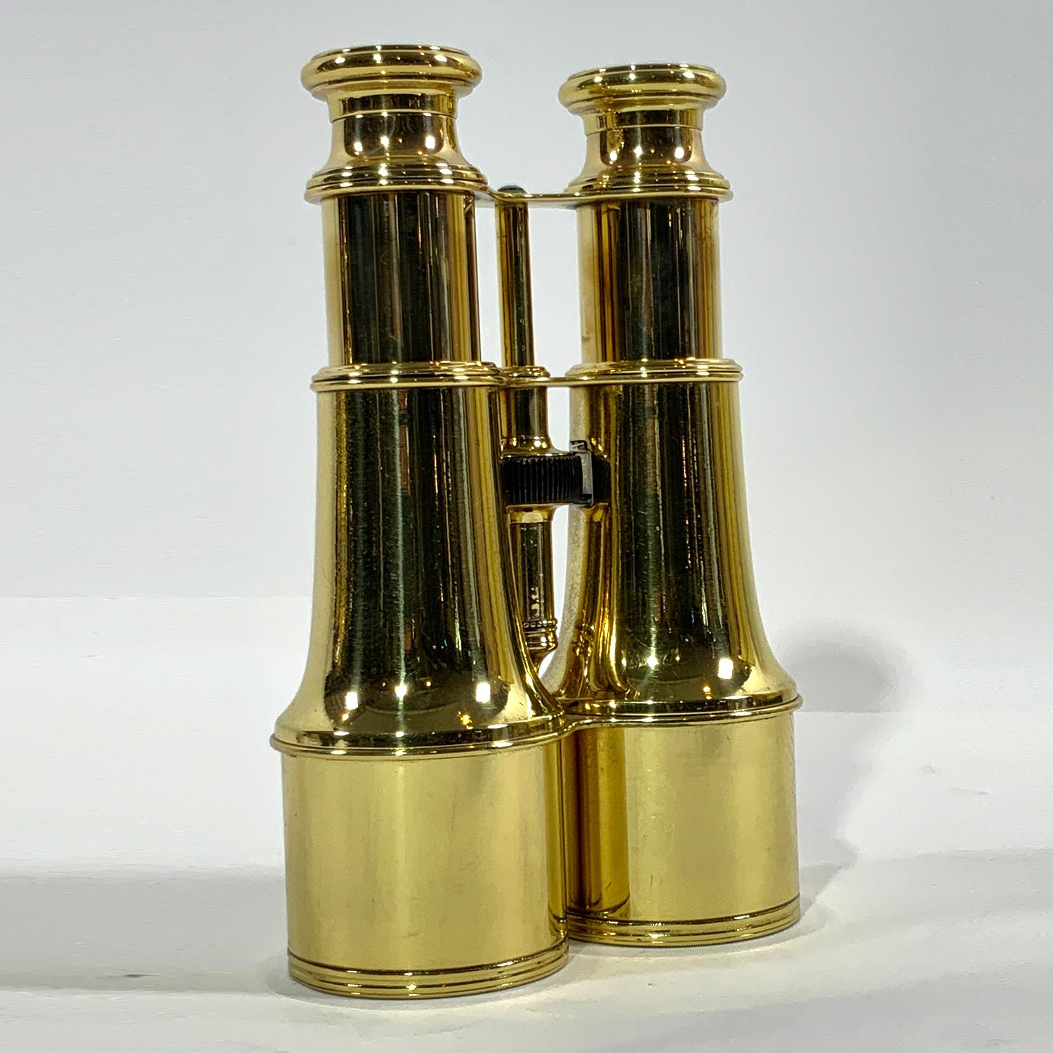 Pair of highly polished and lacquered French made yachting binoculars with engraved eyepieces 