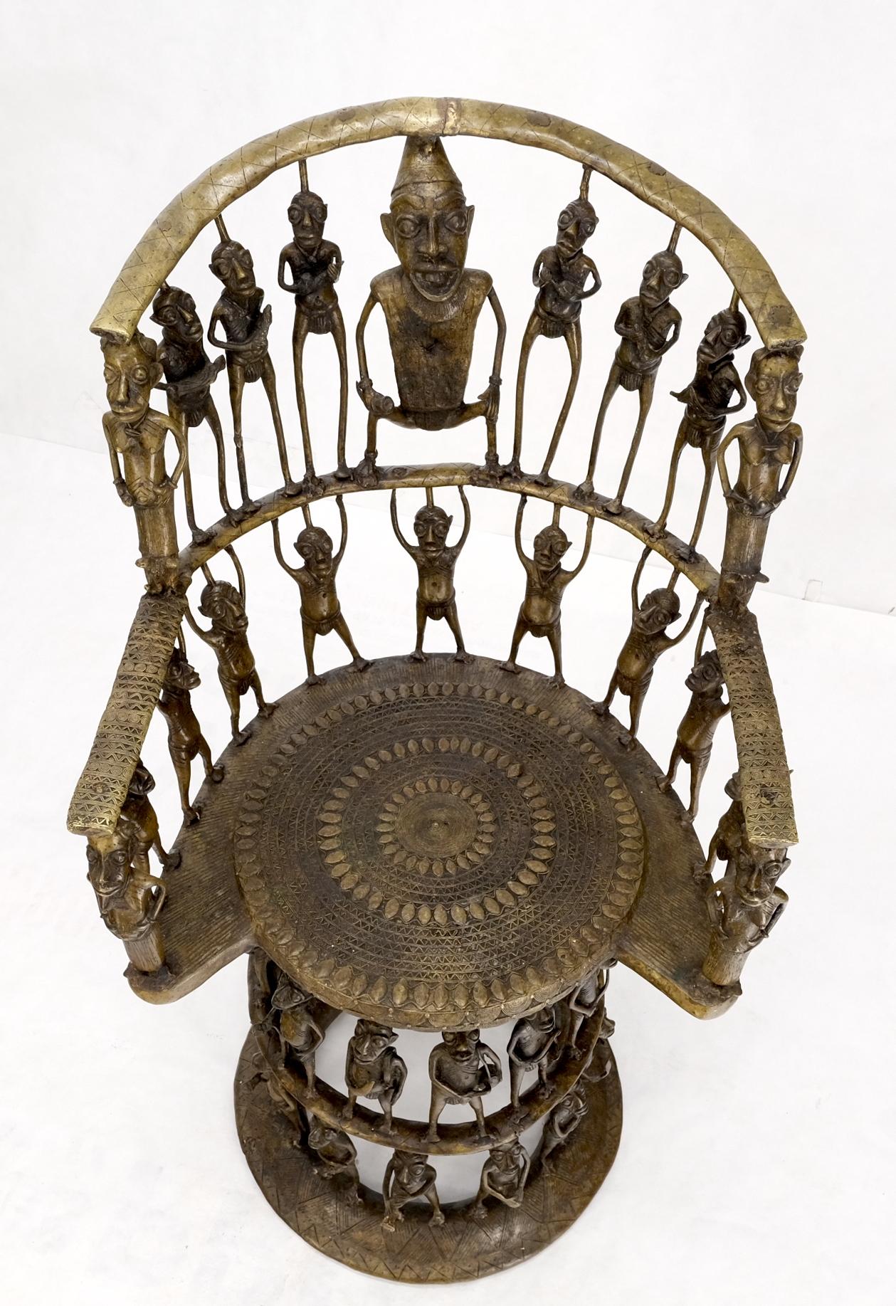 This decorative bronze chair consists of 44 full-figure sculptures. It is made in a style that consciously references pieces from Benin Cameroon West African cultures.