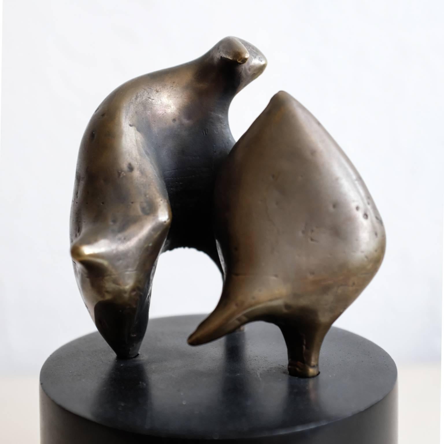 Solid bronze abstract sculpture by Eli Eli Karpel (1916-1988). Rotating ebonized wood base.

Signed by the artist. 

A native of New York, Karpel earned a master of fine arts degree from UCLA and taught there. He had several solo exhibitions