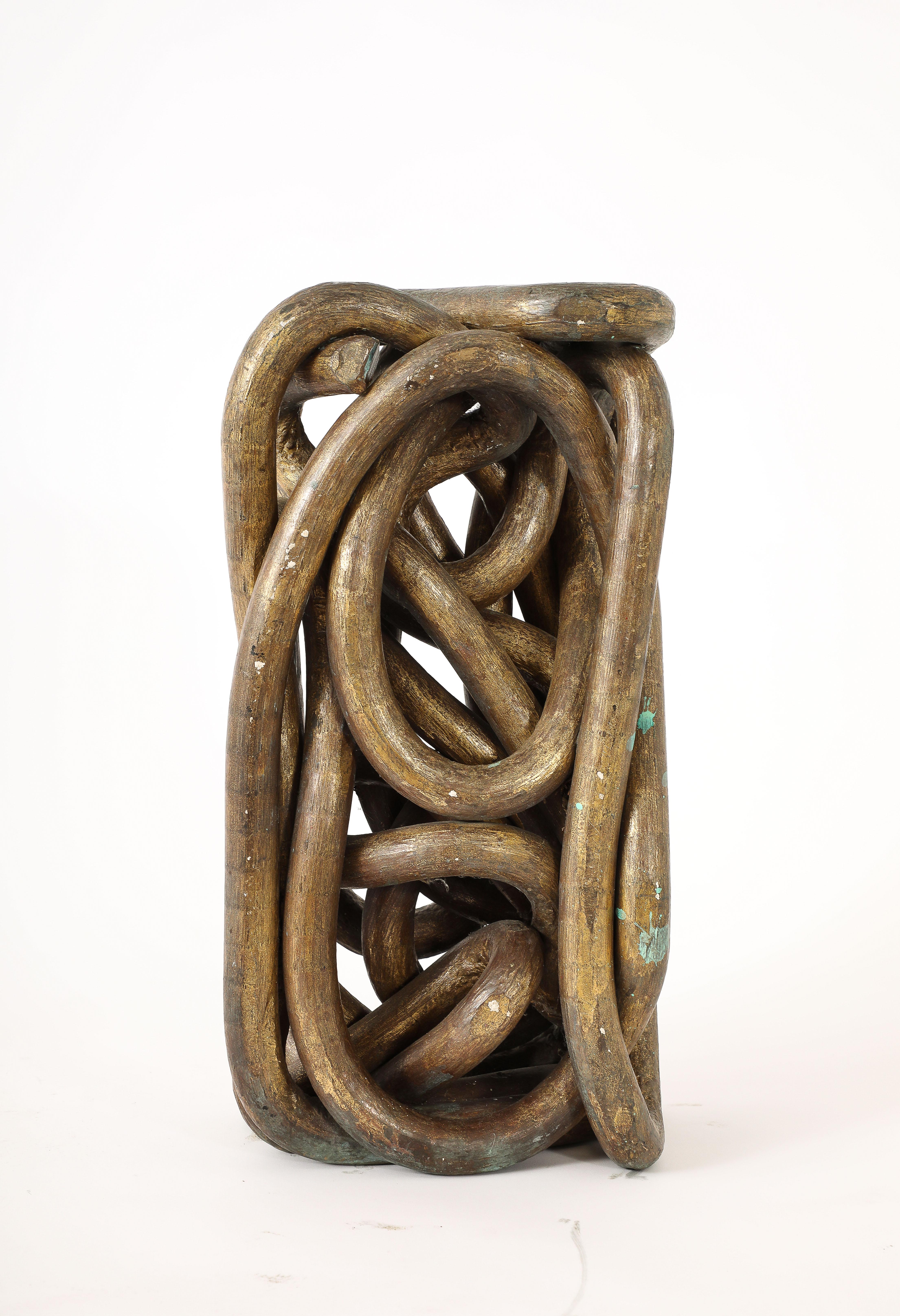 This work was made by bending a very long 3/4 inch solid bronze rod into a rectangular brick, it weighs a surprising 75 lbs for its size