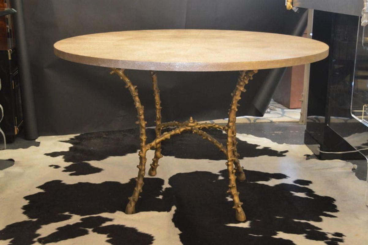 Center table with metallic faux shagreen top and solid bronze legs. In the style of Maison Bagues.