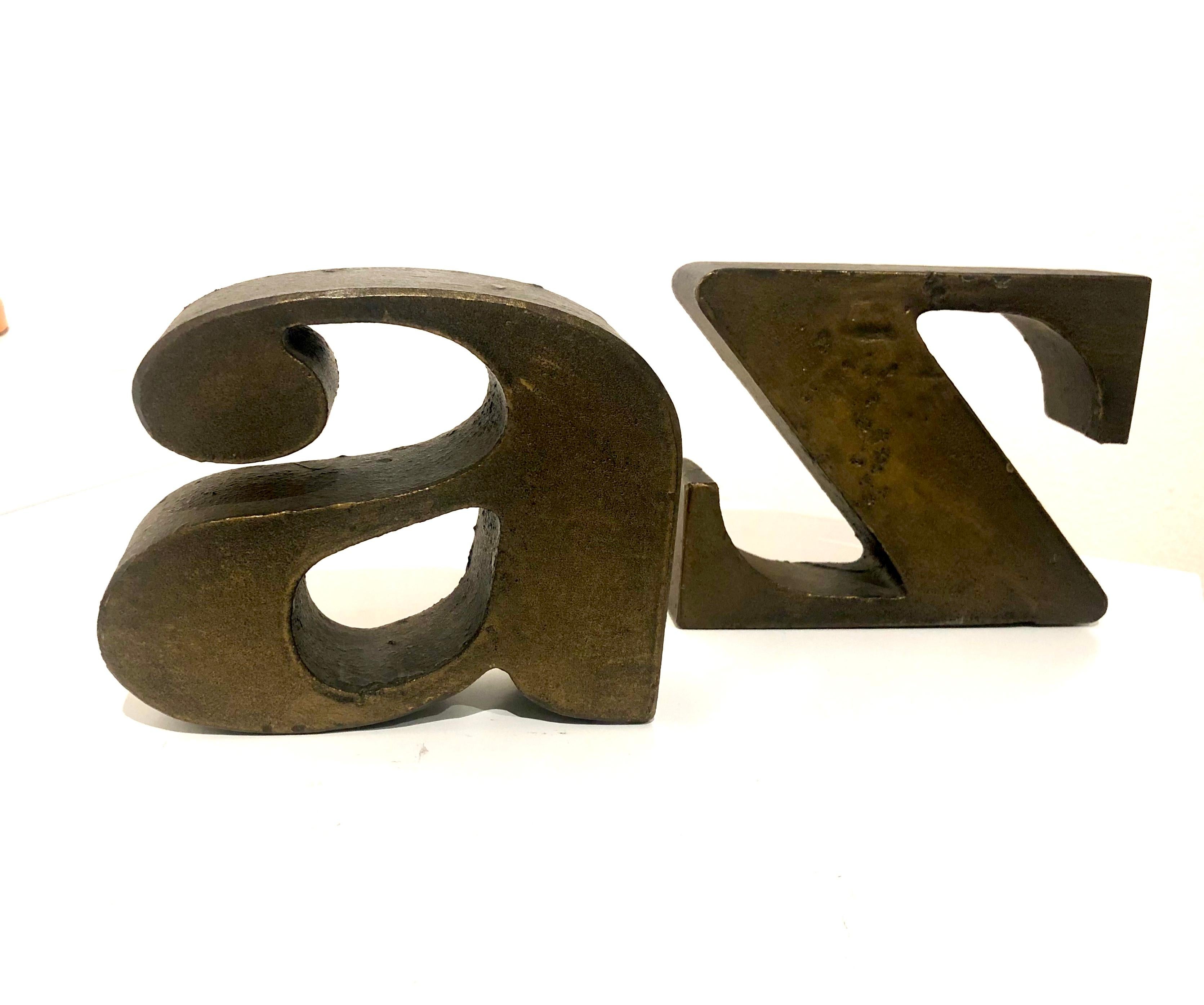 Cool pair of solid bronze bookends, attributed to Curtis Jere original finish.
