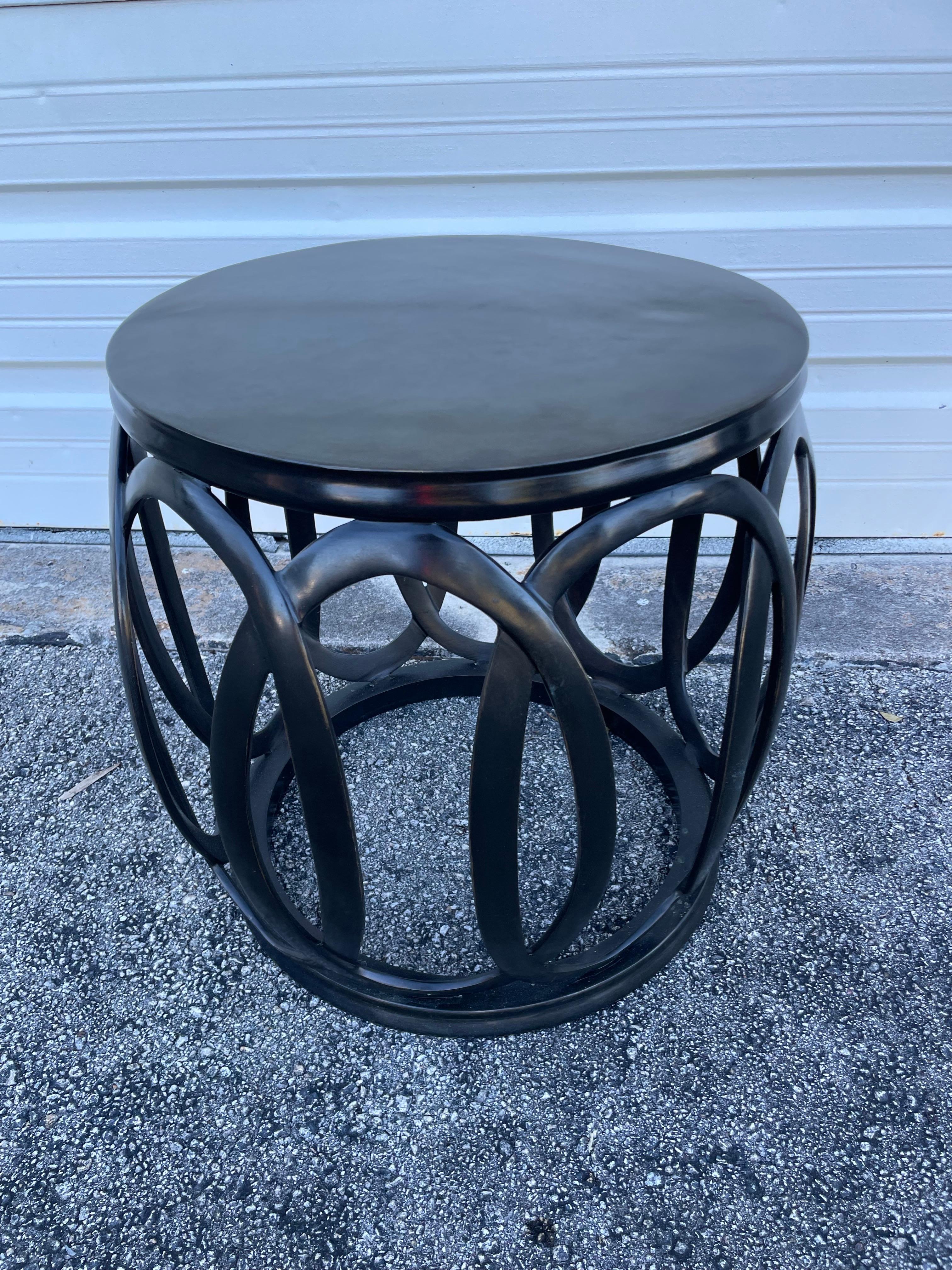 Vintage solid bronze drum table by Barbara Barry. It has an intertwining oval motif all around.
A great drinks or side table in a mid century modern design. Also could be used as a stool.