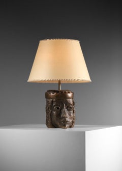 Solid bronze lamp base decorated with a crowned head