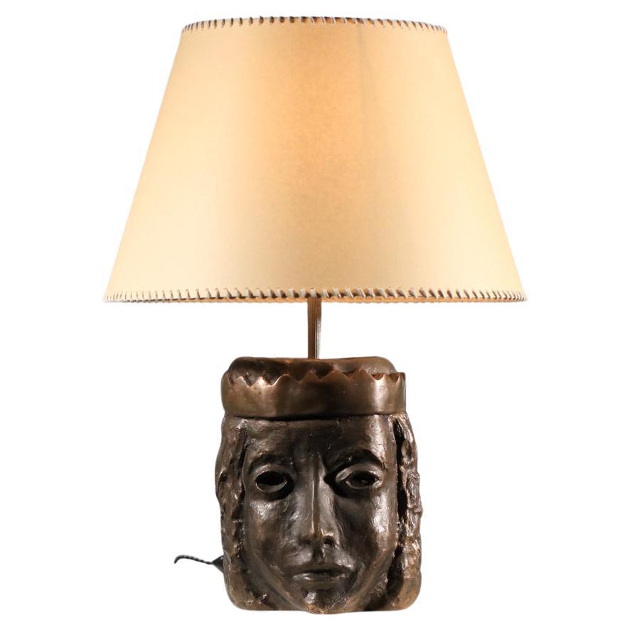 Solid bronze lamp base decorated with a crowned head For Sale