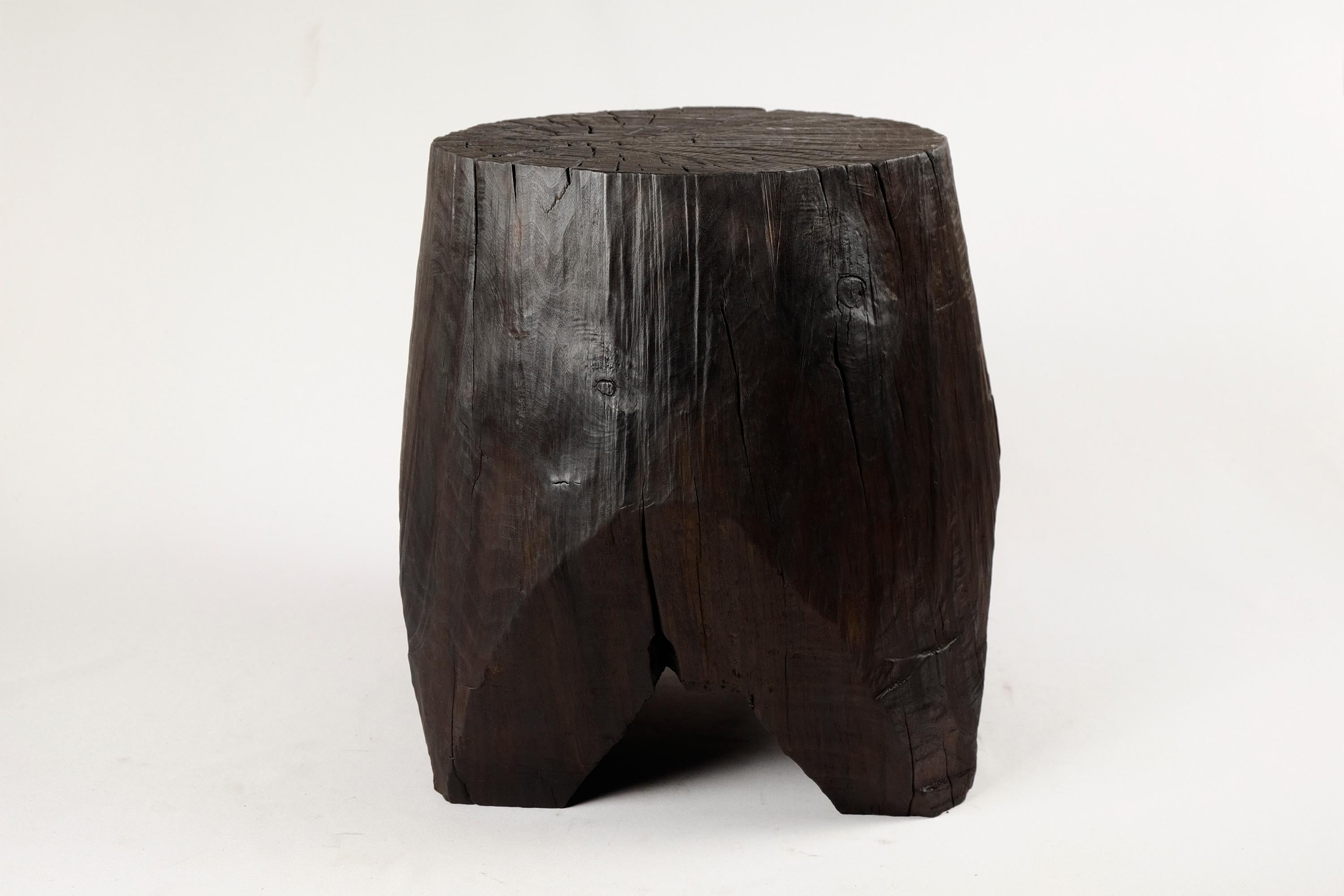 Unique chainsaw carved wooden contemporary rustic side table. Carved from a single piece of wood and protected with the highest quality oils, ensuring durability for generations. Such unique handmade design will highlight your interior and bring