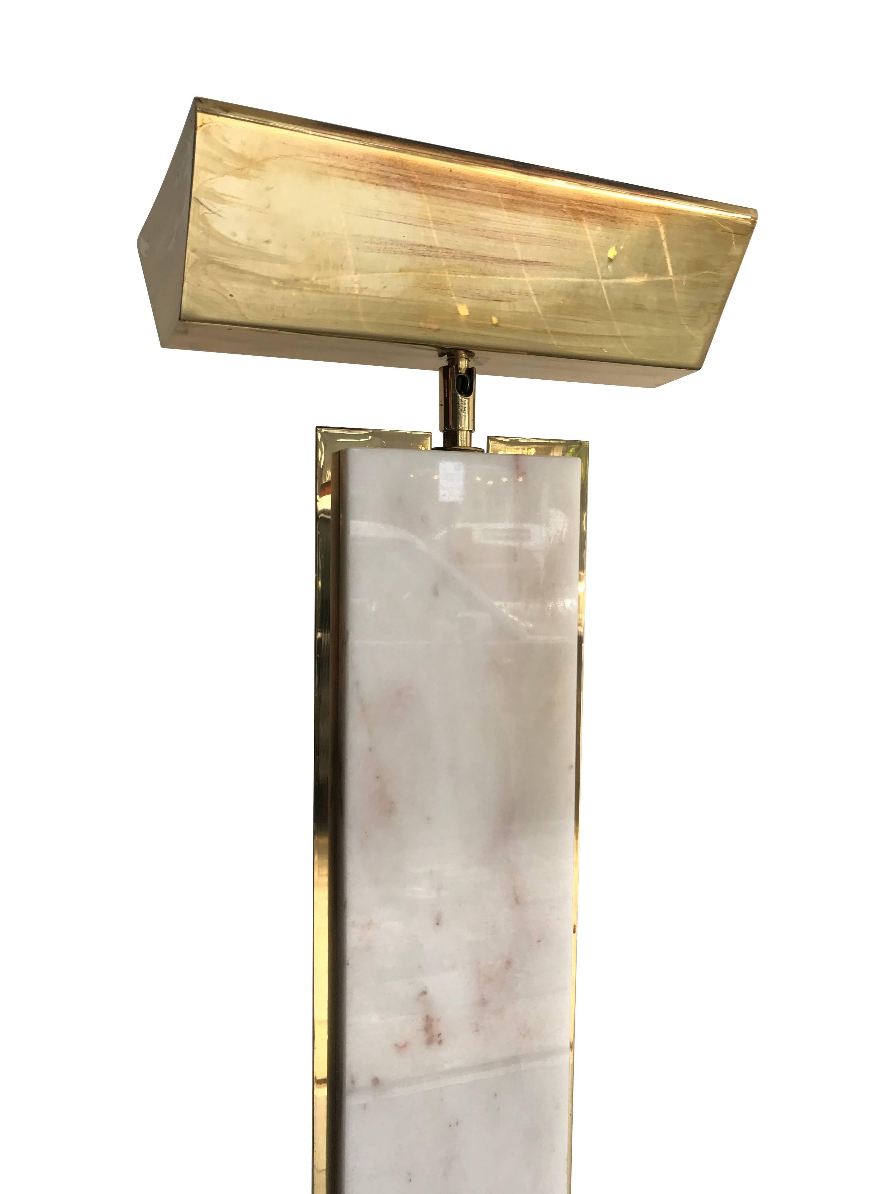 A floor lamp by Mauro Martini manufactured by Fratelli Martini, Italy, 1970s. The base and main column is solid Carrara marble with a slight pink fleck with brass surround frame and brass top uplighter.
Re wired with antique cord flex and foot