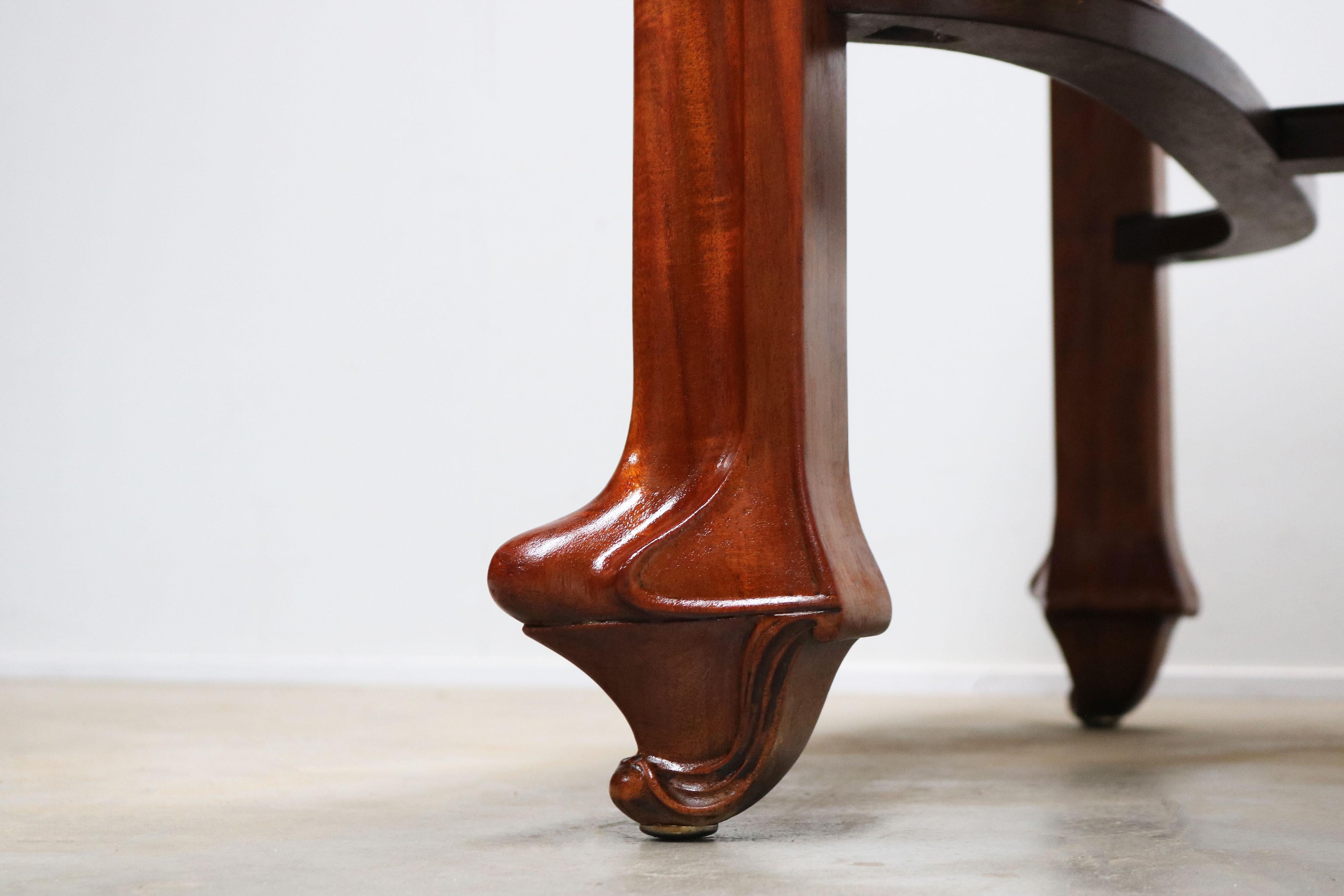 Gorgeous & stylish Art nouveau dining table by Maison Gouffe Paris 1902. 
Hand carved from solid mahogany with superb carved legs. Very high quality piece of furniture with a full inlaid table-top. 
The table comes with a glass table-top that you