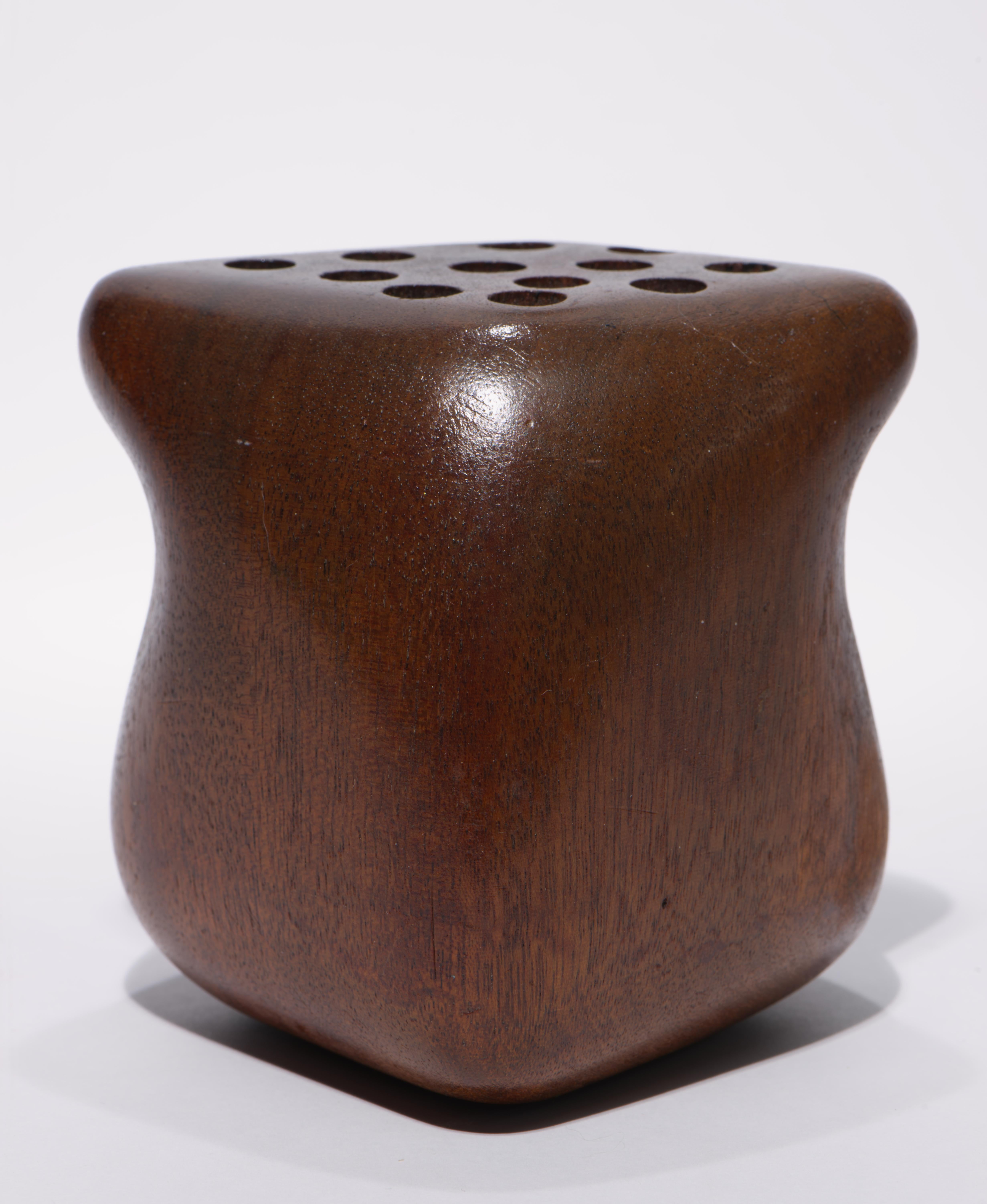 Vintage hand carved pen, pensil, or brush holder features Soft, fluid Mid Century Modern form in solid walnut wood with 12 openings on top. Sculptural, organic shape with slightly asymmetrical sides showcases the graphic wood grain patterns in the