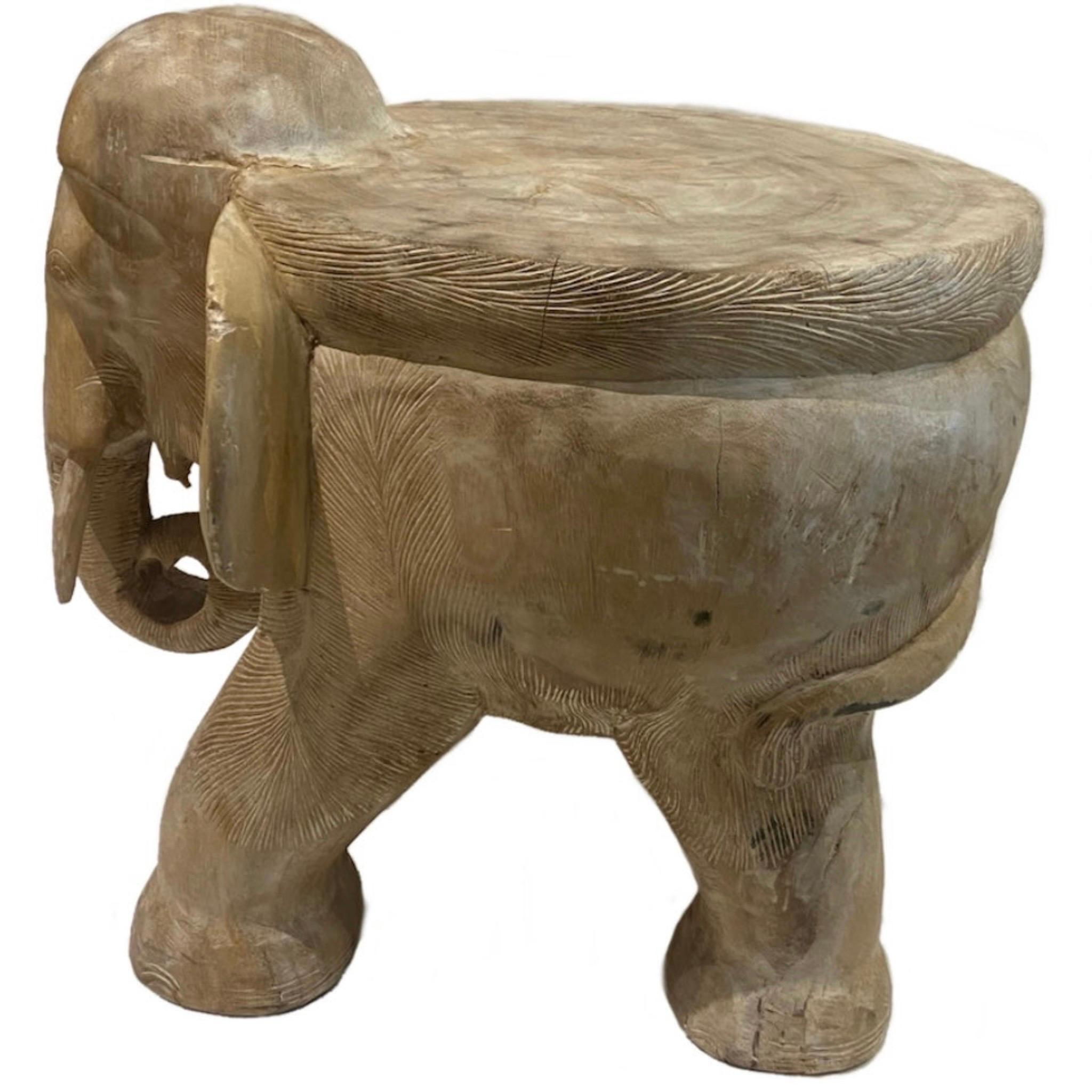 Natural carved wood elephant side table
Carved from a single piece of Blonde Tone Wood
can be used as a stool or accent table
Intricate carving details
There are a few natural cracks in the wood as shown in the images
Shows some wear on the