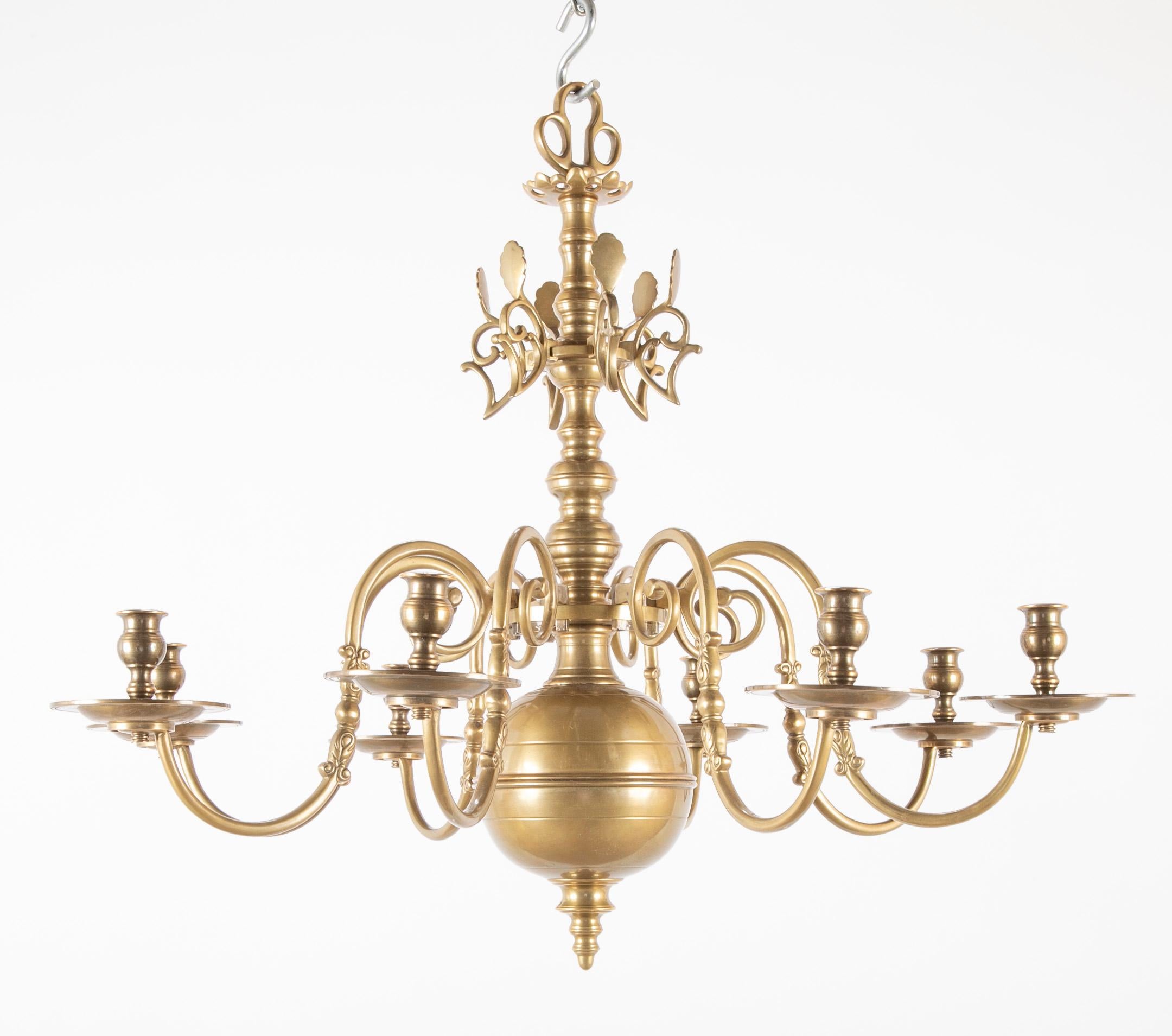 A solid cast brass Queen Anne style eight-arm chandelier with rare reflectors. Possibly Dutch.