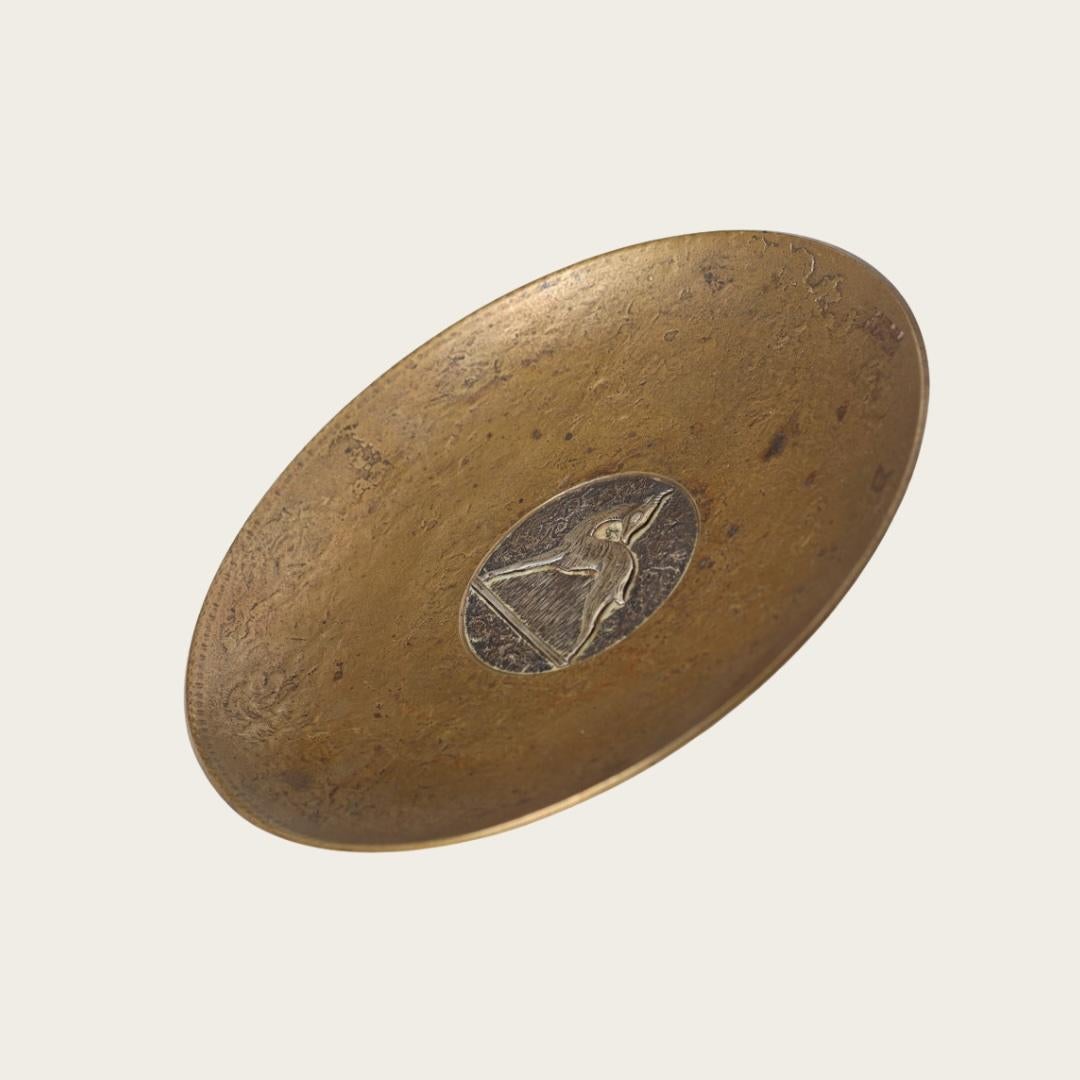 This solid cast bronze footed dish features a detailed Swedish Grace deer relief by Evan Jensen (1888-1978). Originating from 1940s Denmark, it is stamped 