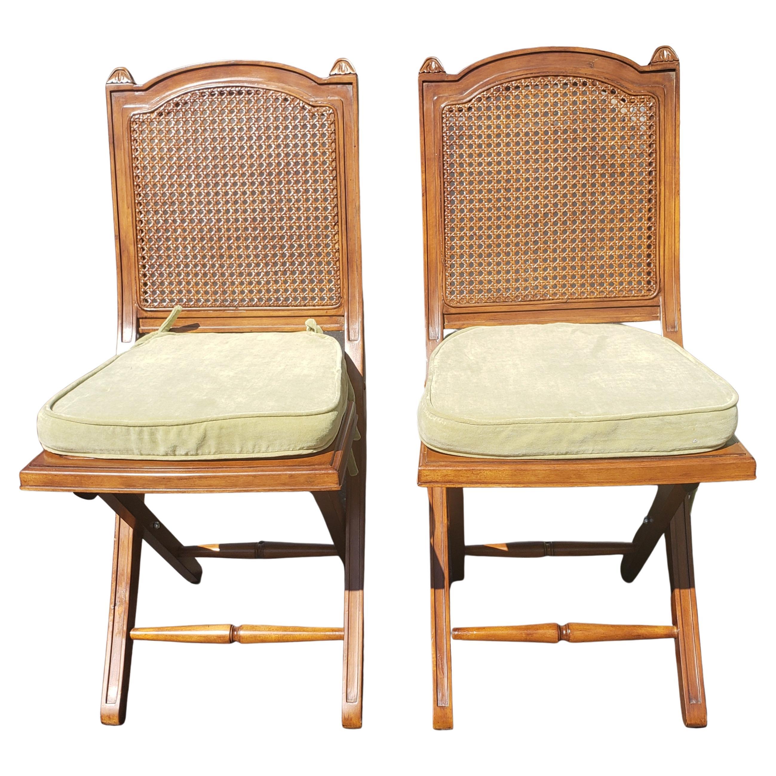 Exquisite pair of solid cherry and cane seat and back folding chairs with cushions.
Very well kept and in excellent vintage condition. Come with soft green velvet cushion in like-new condition.
Measures 14.5