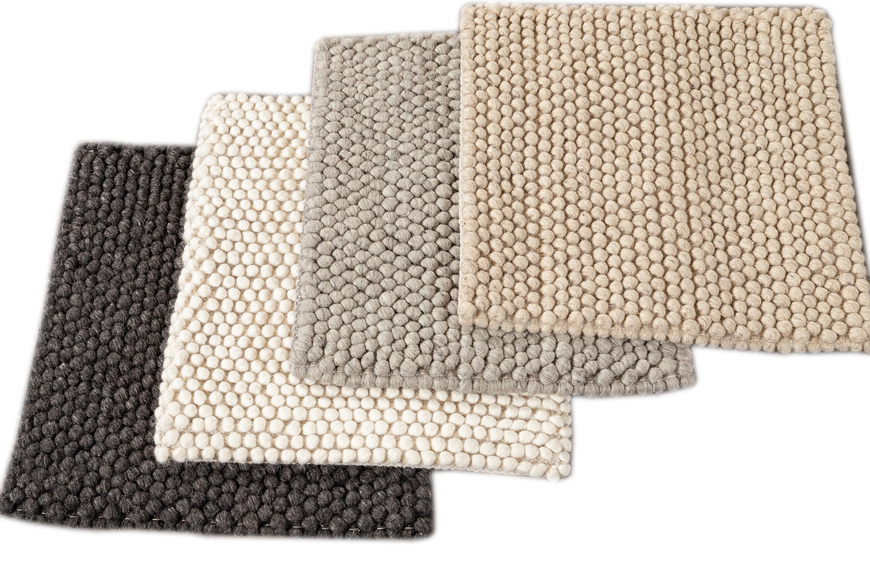 Solid colored textured custom rug. Custom sizes and colors made-to-order.

Material: 100% wool
Lead time: Approximate 12 weeks
Available colors: Charcoal, Ivory, Grey, Beige
 