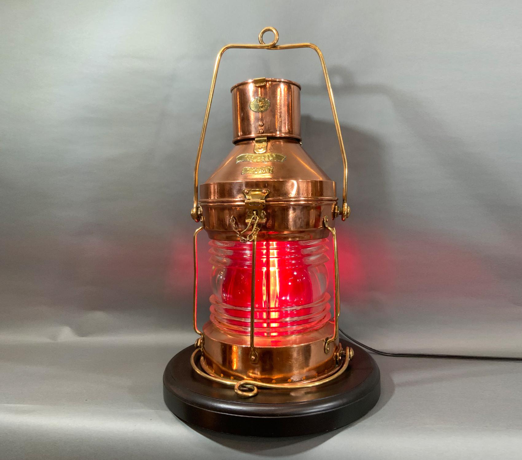 Clear Fresnel glass lens, removable red lens. Fitted to a mahogany base. Brasses include badges, handles, hasp, hinges, bars, etc.

Weight: 16 lbs.
Overall Dimensions: 22