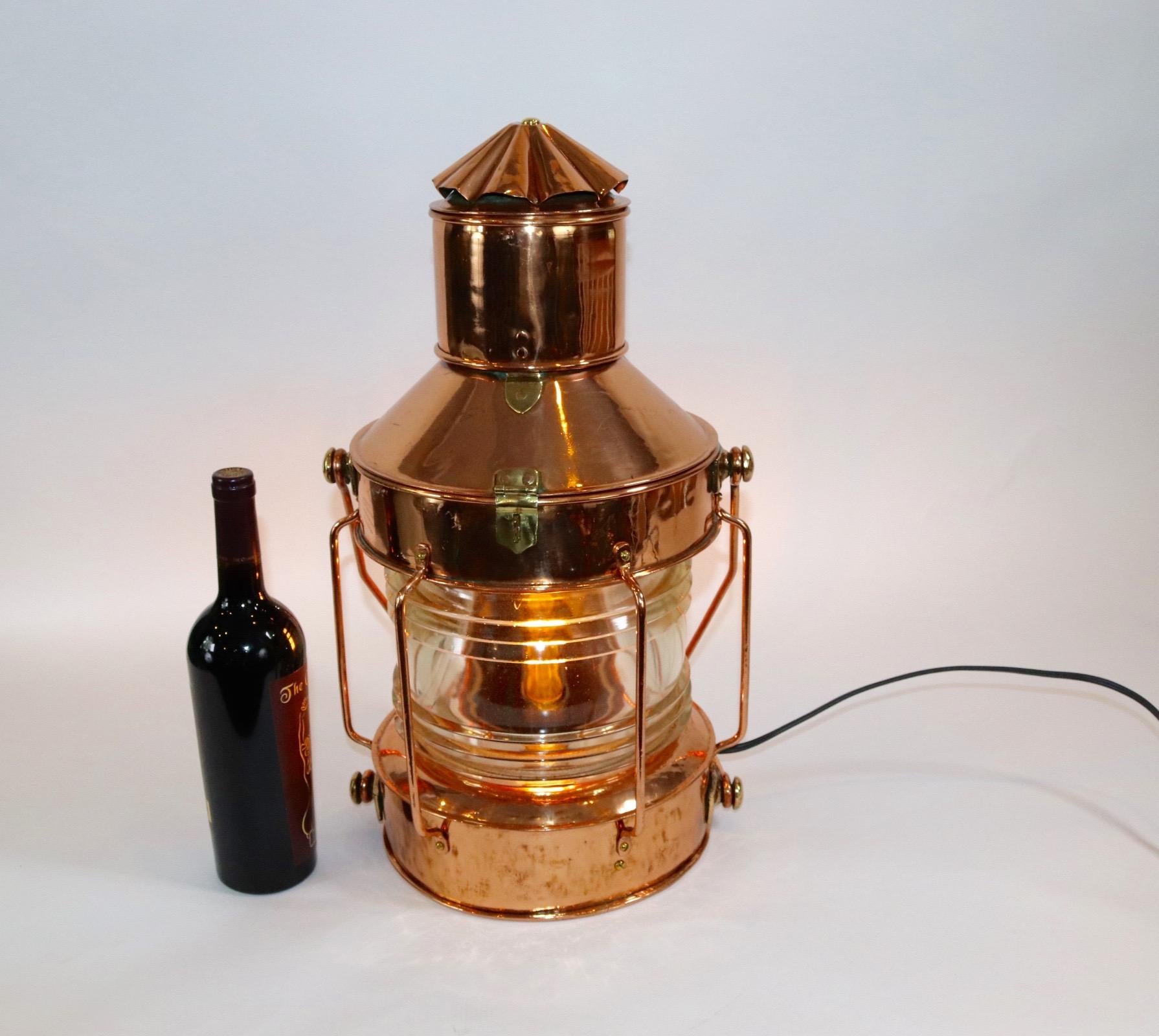 Highly polished and lacquered ships anchor lantern with a thick Fresnel lens [Please see the picture showing a piece of missing lens). Lantern has been electrified for home use. Weight is 19 pounds.