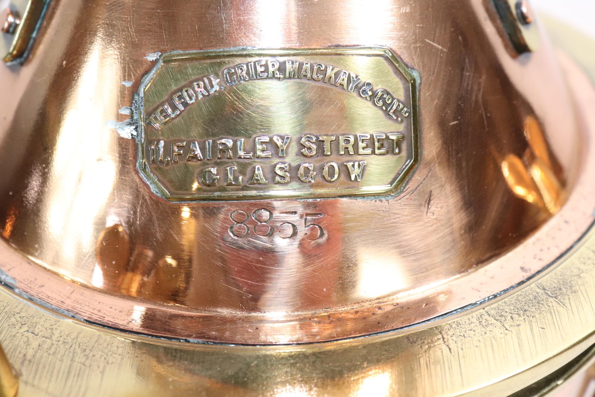 Sturdily built solid copper ships anchor lantern with fresnel glass lens, heavy protective brass bars, brass makers badge with name of Telford Grier, Mackey & Co. Limited , Glasgow. Mounted to a thick wood base and wired with socket for home