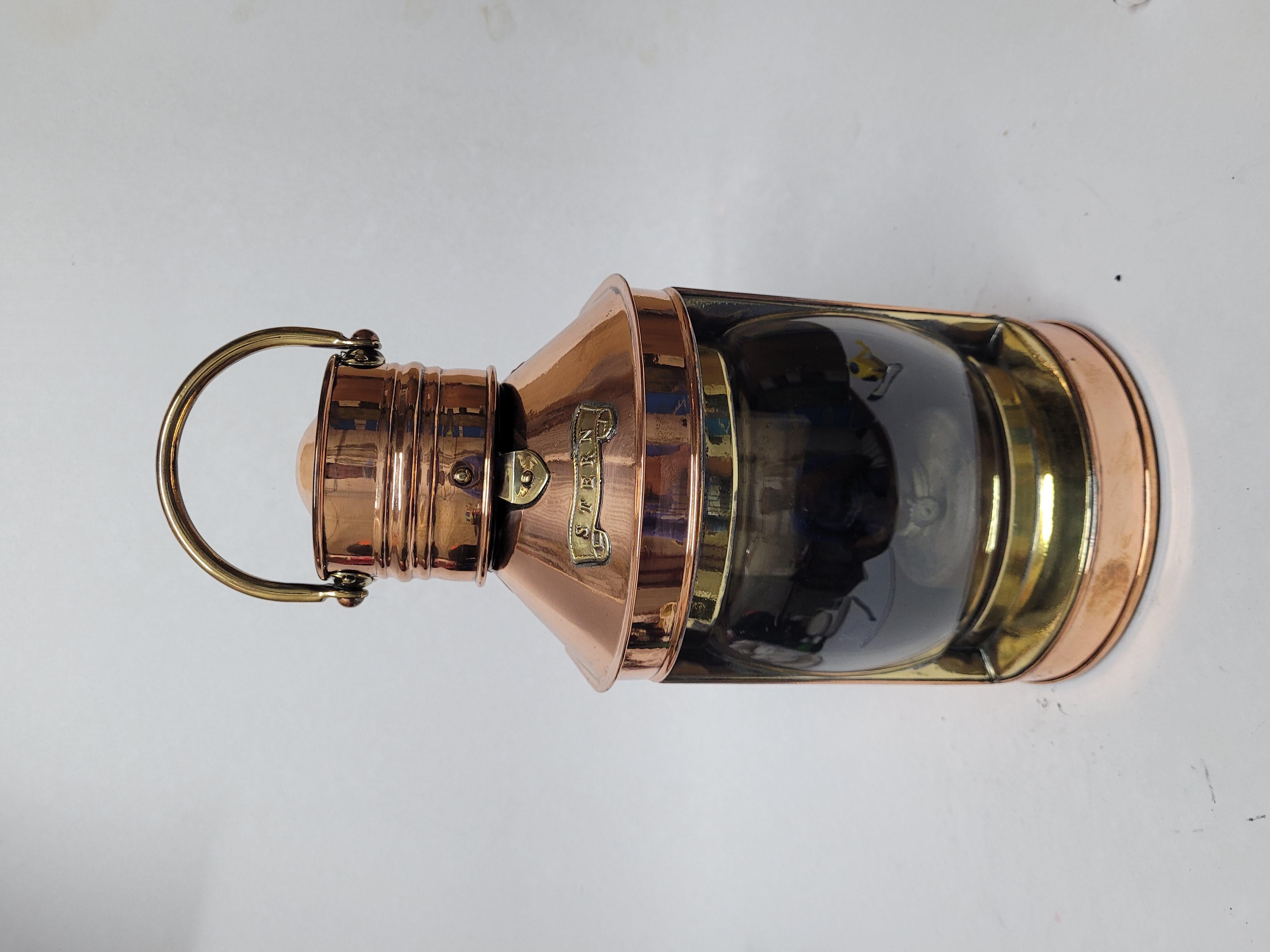 Awesome polished cooper ships lantern by Davey of London. With brass stern badge, lens bezel, makers badge and carry handle. Fitted with original burner. Makers badge reads Davey and Company London 38 West India Dock Road. Choice English marine