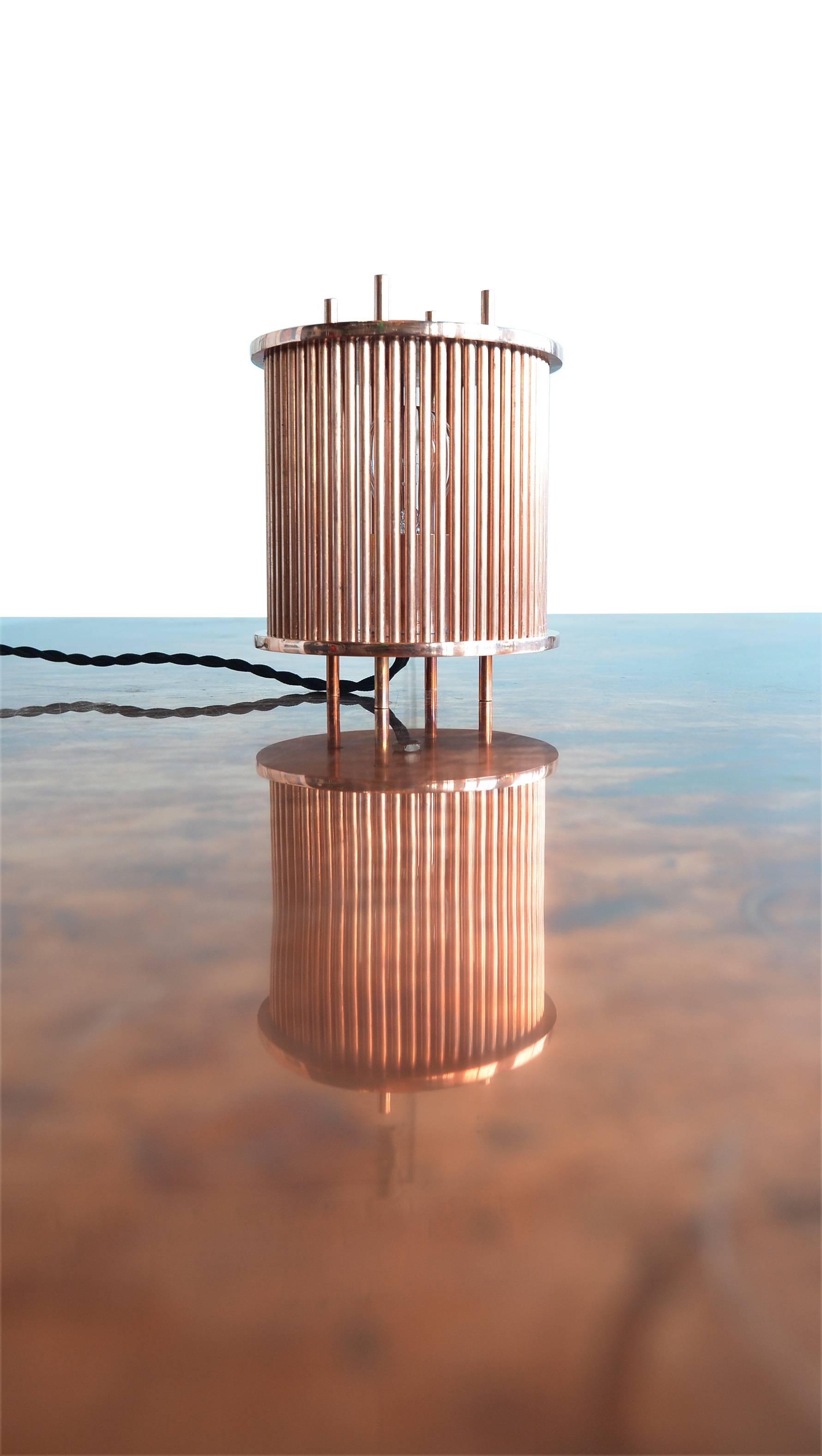 An incredible, bright solid copper table lamp by Porch Modern. 

These lamps are created from solid plate copper and rod. Milled inset holes holding 63 individual solid copper rods. 
Lit with a single raw build which produces incredible shadows