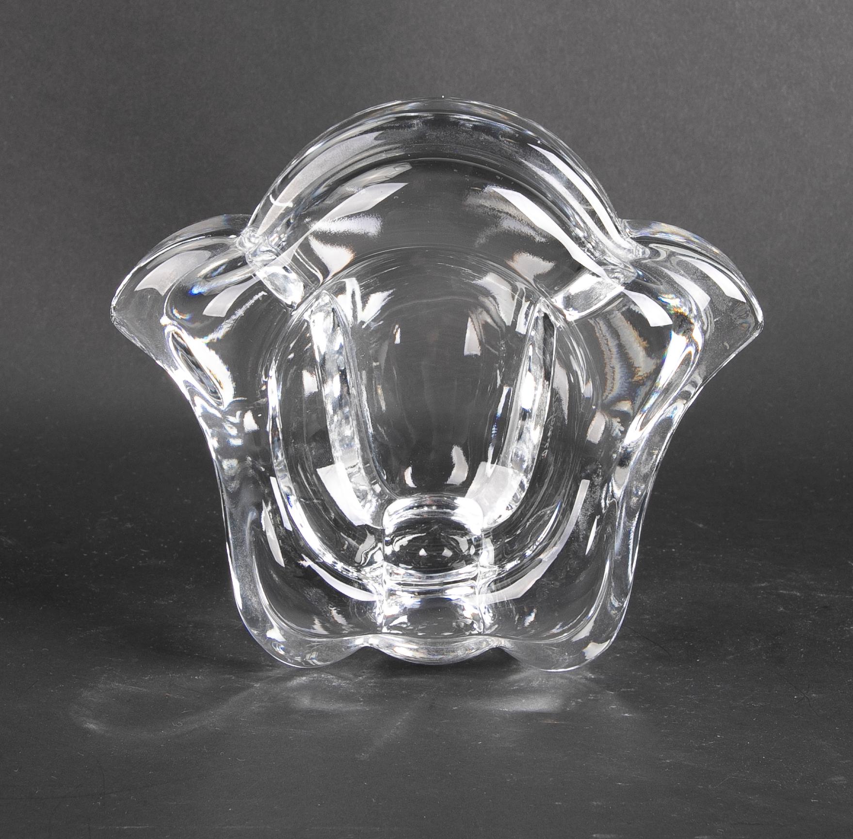 Solid crystal ashtray in the shape of a flower.