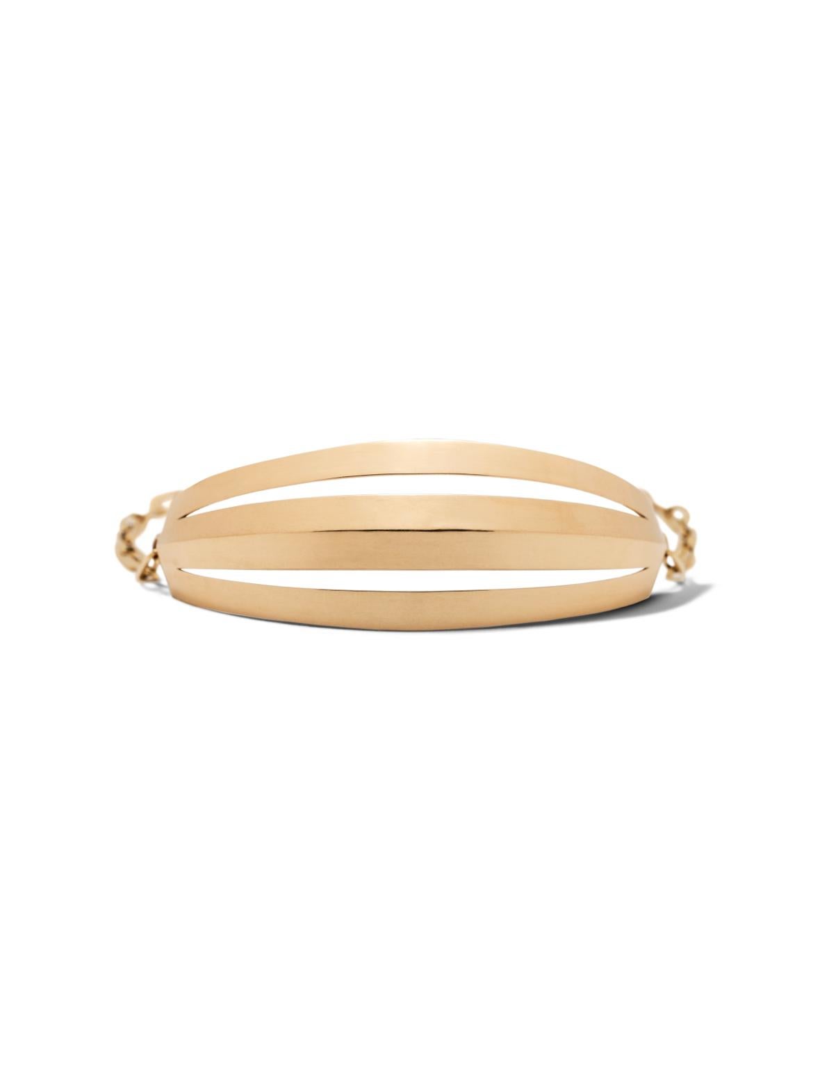 This piece features a substantial, breathable gold bar, linked to a chain and an eye-catching sun charm. With its exceptional design, it makes an ideal accompaniment to any timepiece or our Jazz Fingers hand chain. Don't miss out on this grand,