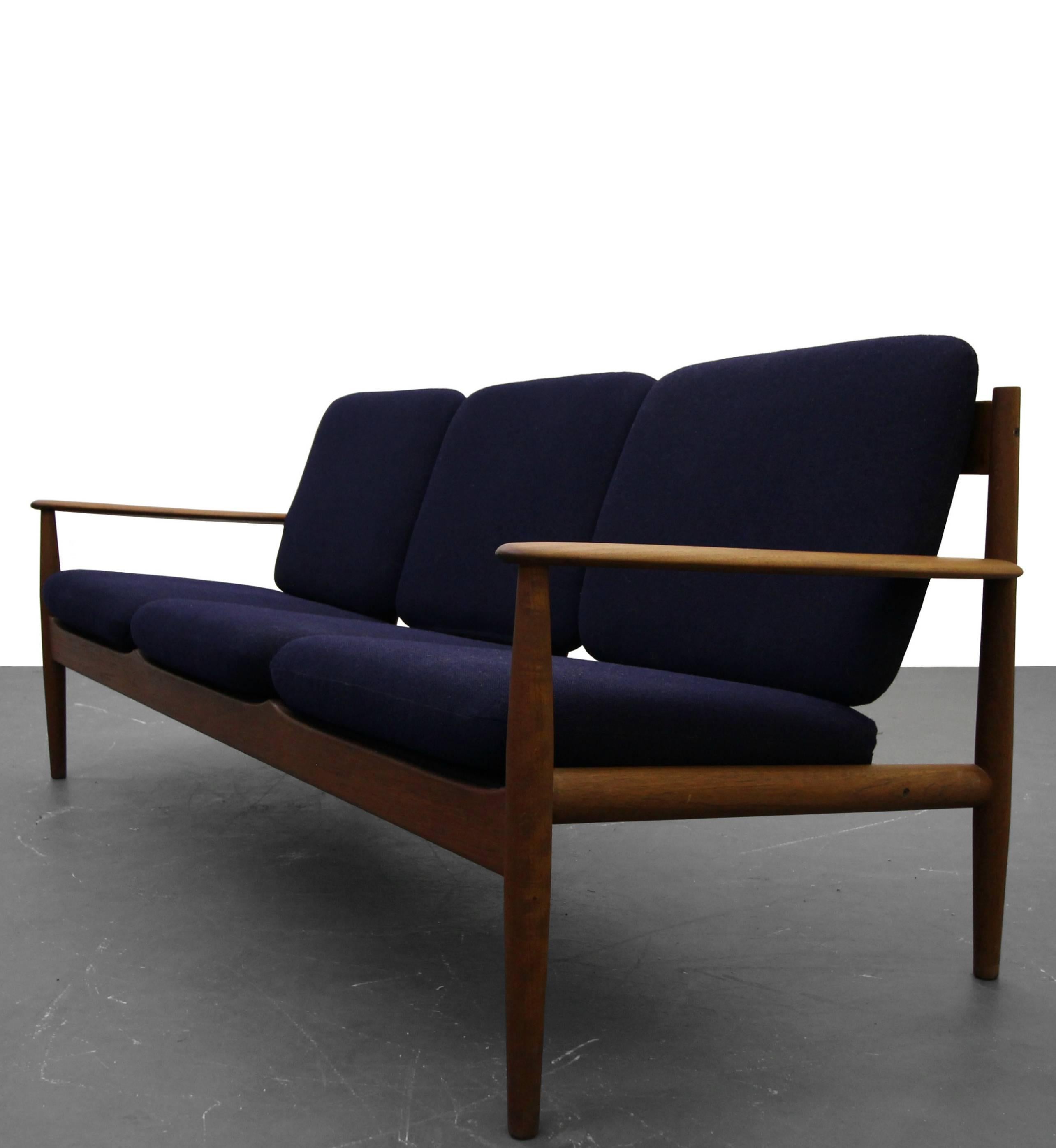 This is the classically perfect, solid teak, Danish sofa designed by Grete Jalk for France & Son. This is a beautifully designed sofa with gorgeous curvature details on the open slat back. This sofa is a simple and clean Danish design that will