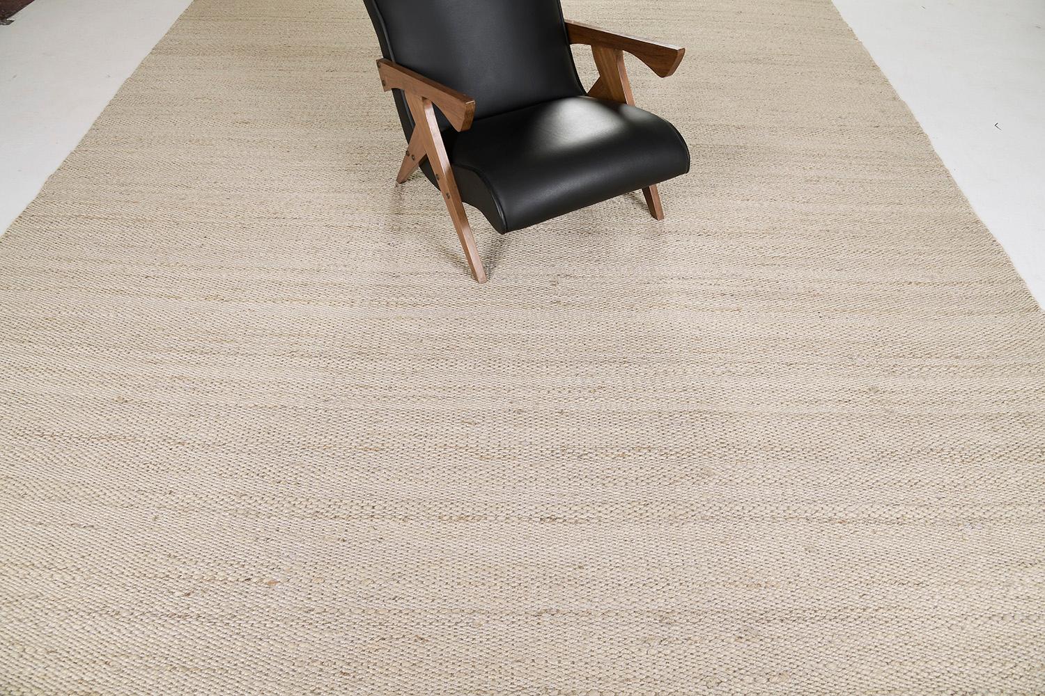 A solid design flatweave features horizontal strokes of gold and brown hemp. Embedded with beautiful tassels that match the simplicity yet a sophisticated kind of masterpiece. This decor will add harmonies to your modern interior and lift the mood