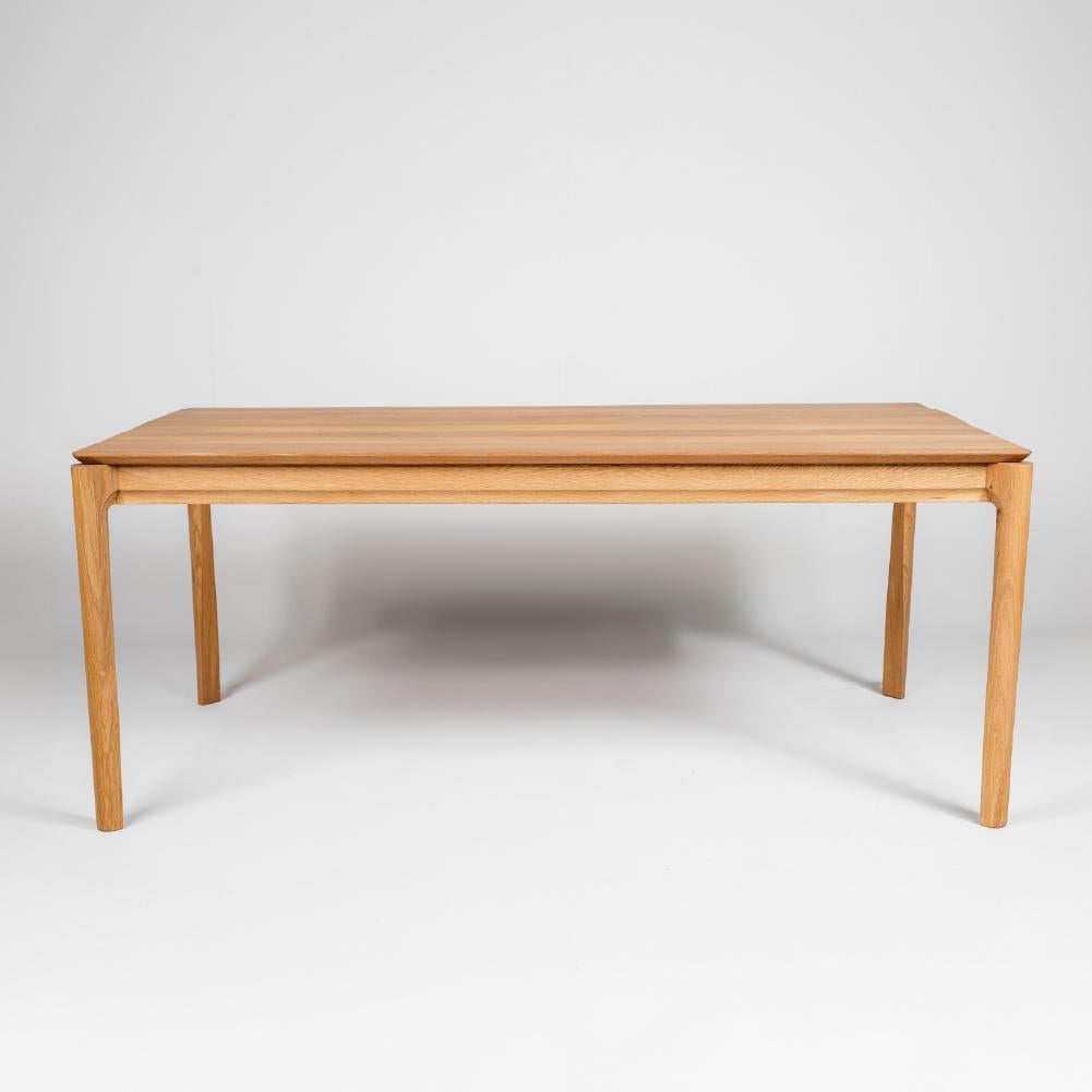 The Solid Dining Table provides a spacious seating area with its rectangular design and elegant leg structure. It is made entirely of solid oak wood. Its minimal design will enable you to create enjoyable dining spaces in your living areas.