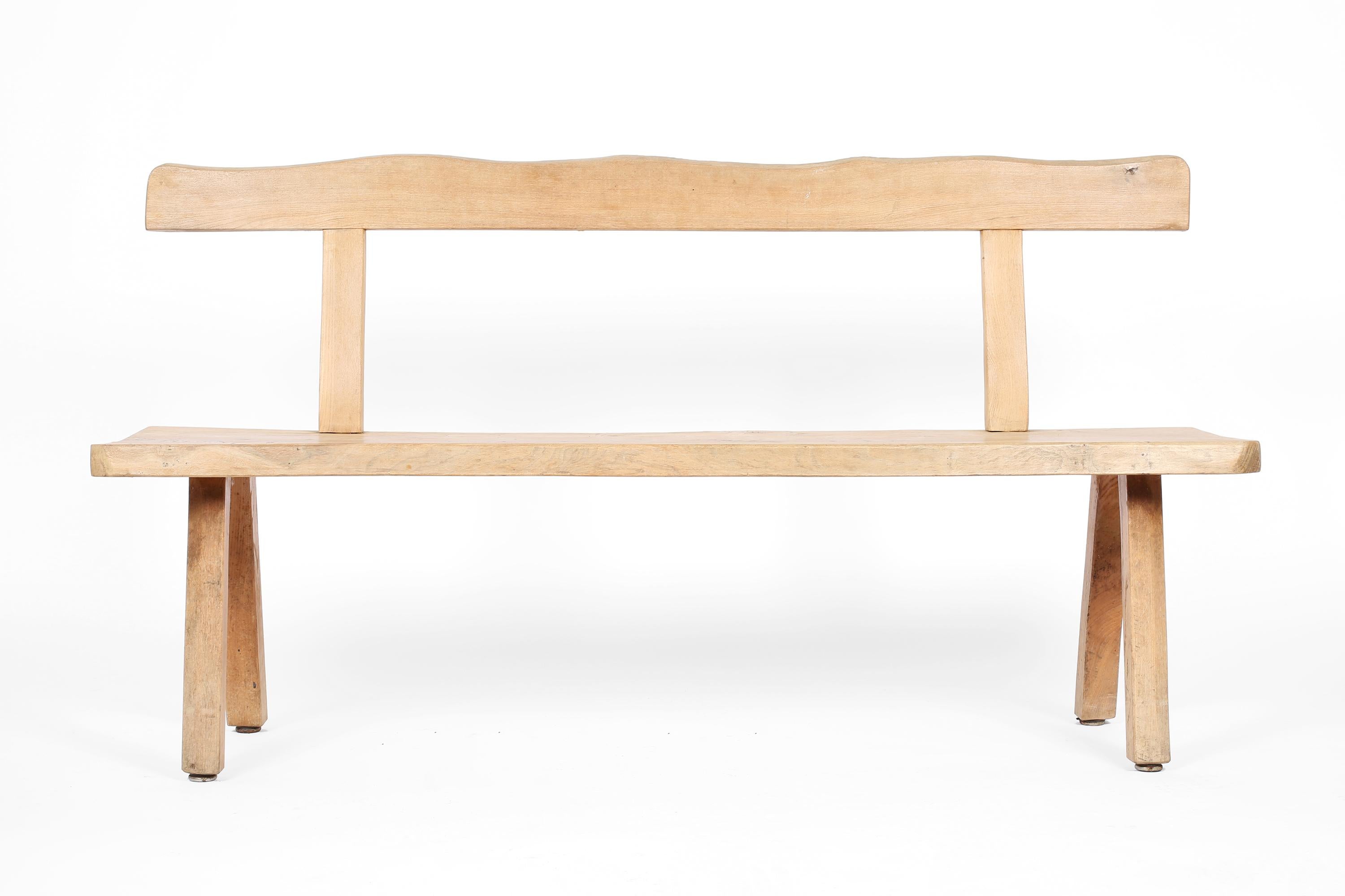 A stripped solid elm bench attributed to Olavi Hanninen for Mikko Nupponen. Finnish, c. 1960s.