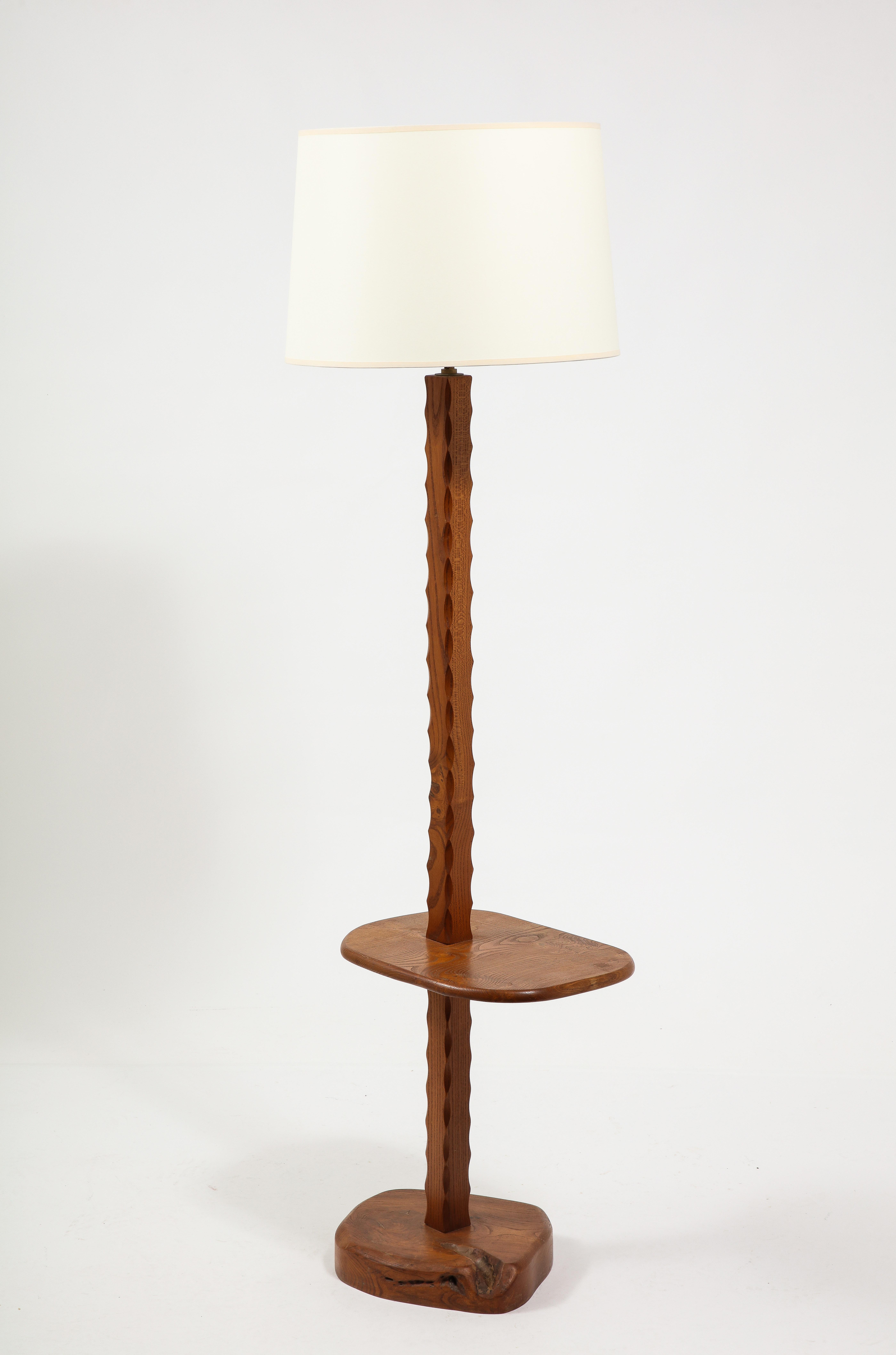 Solid Elm floor lamp with a shelf, with a carved motif on the stem.
