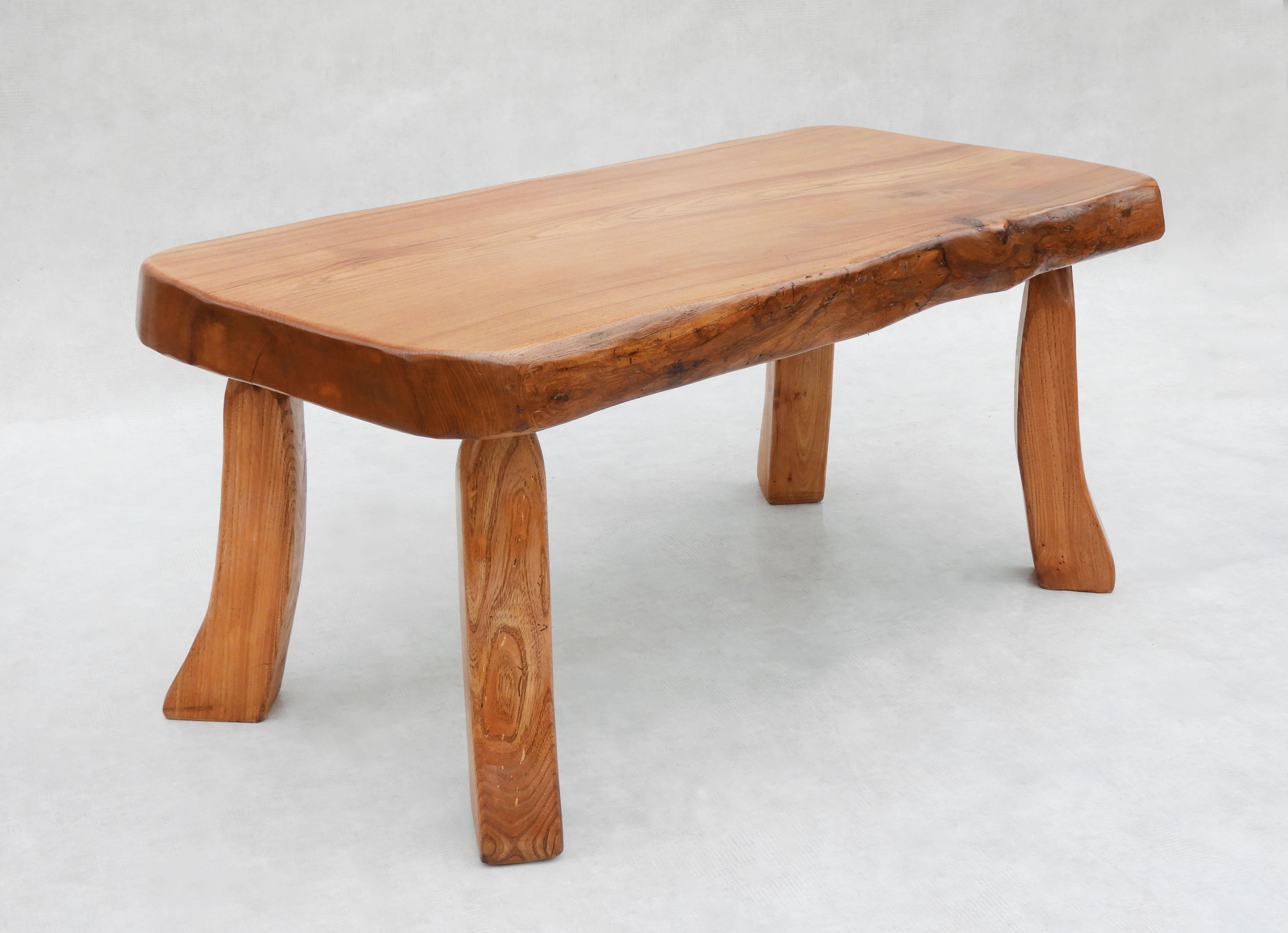 Fabulous live edge slab table and tripod side table/stool set C1970s France.
Hand crafted, Artisan made in the Ardeche Mountains of France.   A solid Elm slab table with live edge detailing and three smaller stools that work equally well as side