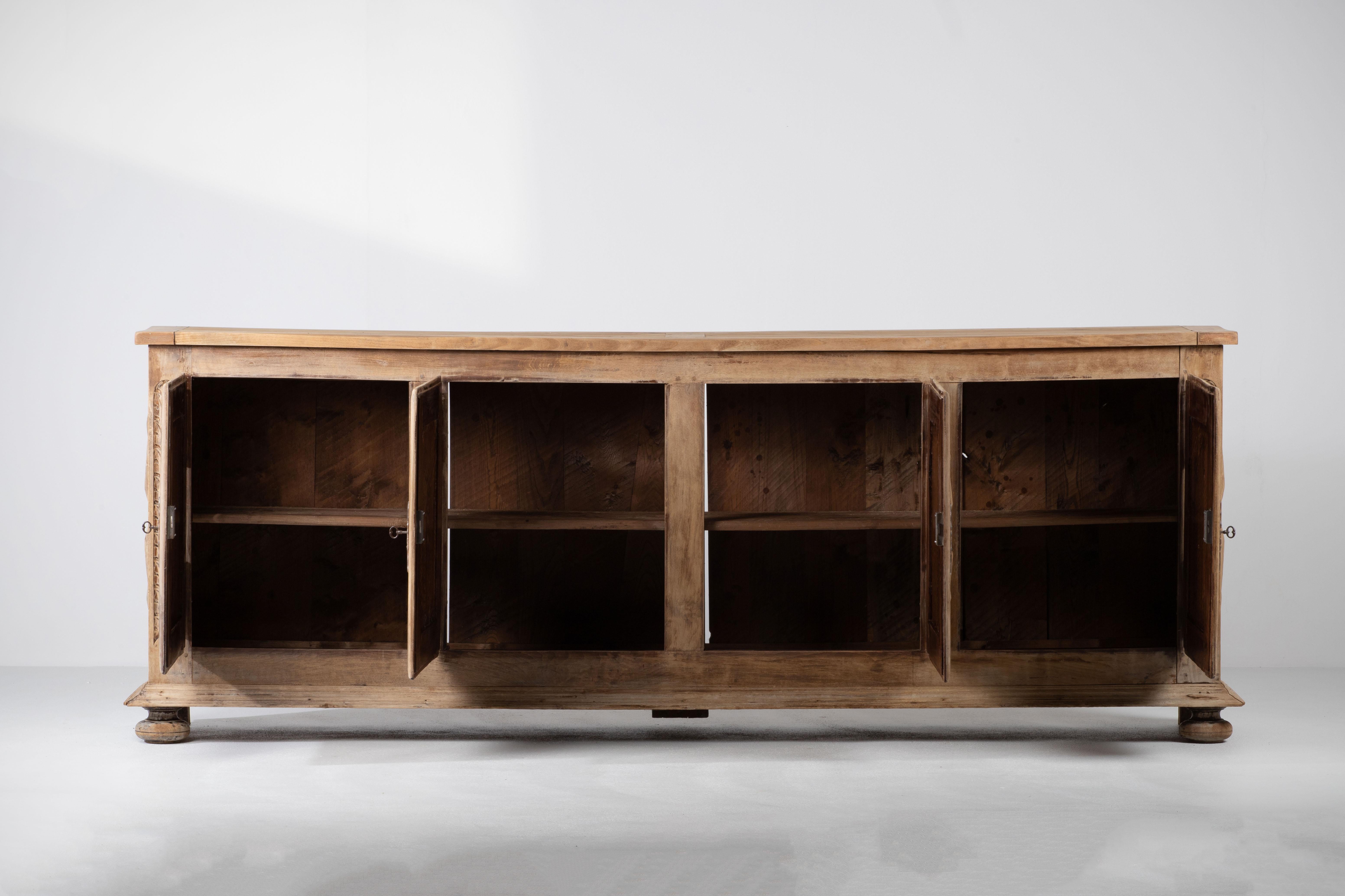 Brutalist Solid Elm Sideboard, Louis XIII style
The buffet features stunning diamond carved door panels. It offers ample storage, with shelve behind the doors.  The sideboard is in good original condition, with minor wear consistent with age and