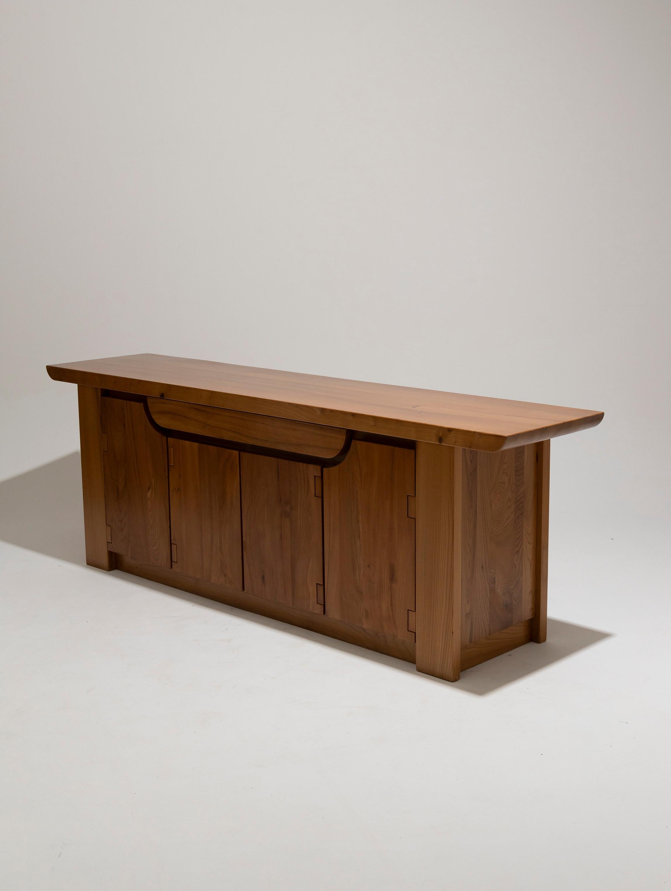 Sideboard or large buffet in solid elm by Italian designer Luigi Gorgoni, produced by Roche-Bobois in the 1980s. Features four doors opening to shelves and a spacious storage drawer. Original Roche-Bobois label on the back. In excellent