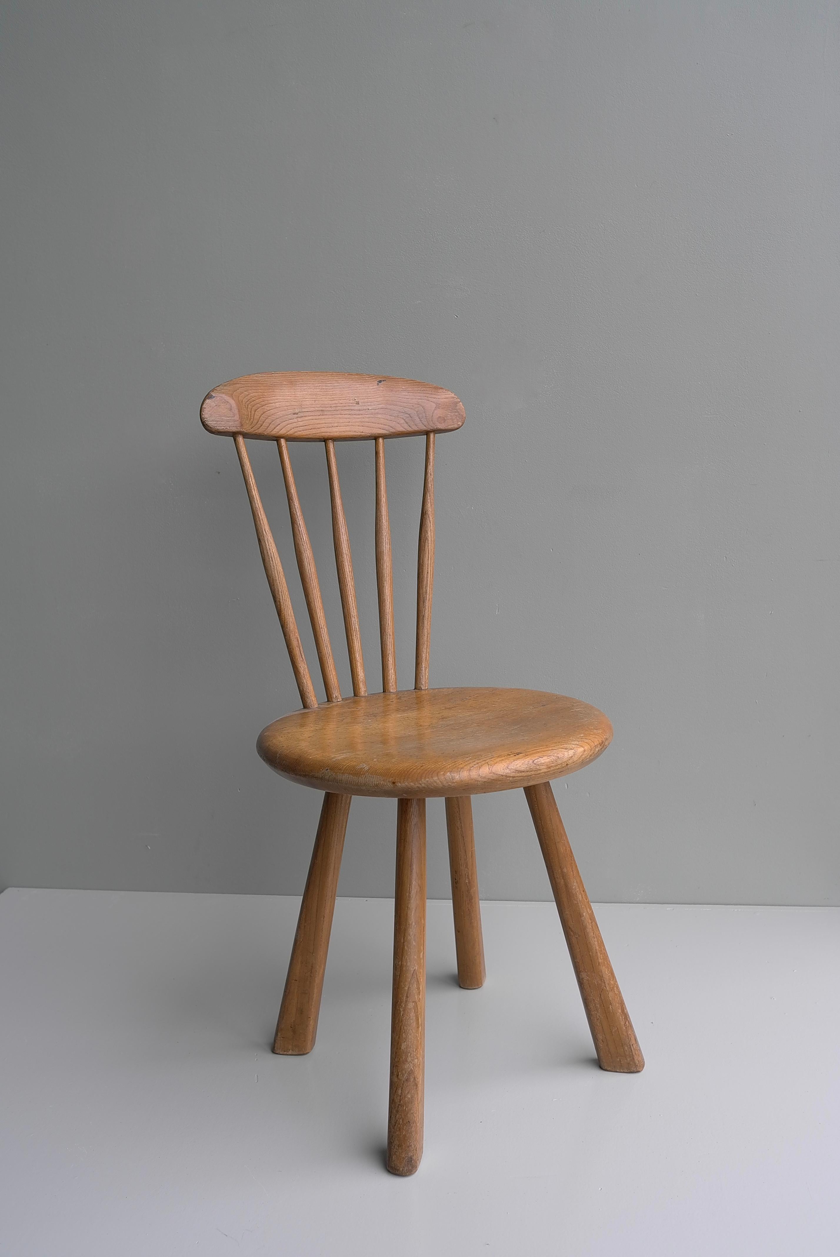 Solid elmwood side chair, France 1950's.

This stool has a beautiful structure in solid Elmwood with a warm natural patina.
There are 2 chairs  available.