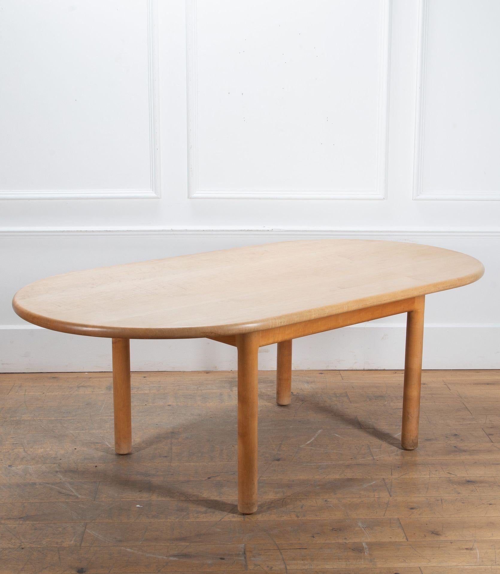 A solid English maple dining table designed by Sir Terence Conran and made by Sean Sutcliffe for Benchmark Furniture.
Sean Sutcliffe trained under legendary English furniture maker John Makepeace and founded Benchmark Furniture with Sir Terence