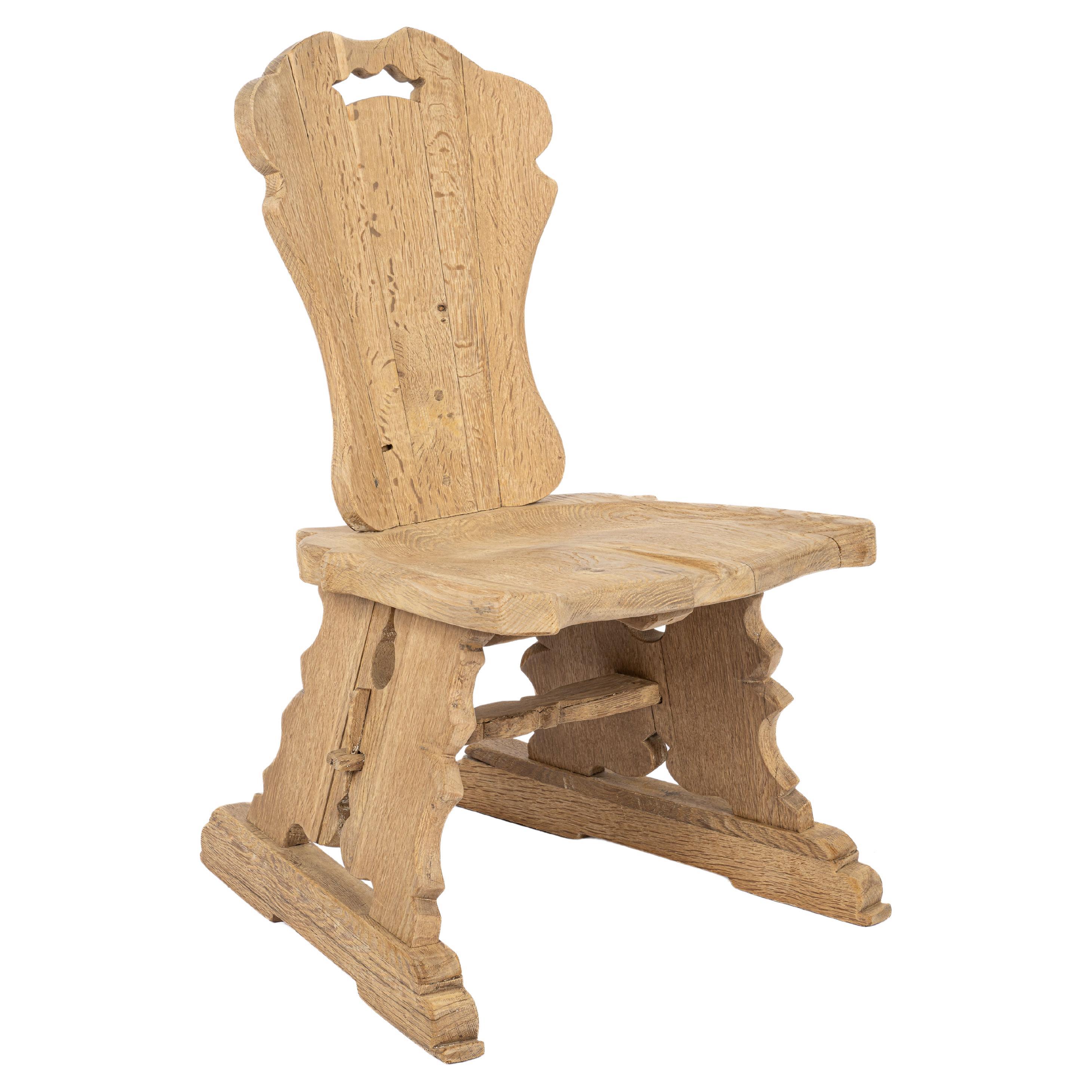 Solid European Oak sculpted chair made by Piet Rombouts circa 1950 Netherlands For Sale