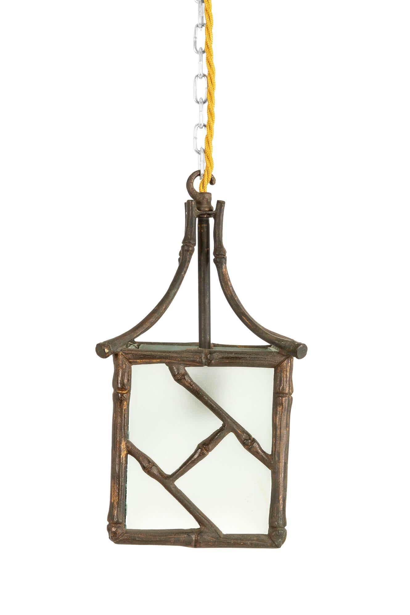 A solid brass faux bamboo pendant lantern with a patinated gilt finish. Art Nouveau style, in the manner of Maison Bauges Paris. The epitome of French design know-how. Four paneled lightly frosted glass sides with ceiling rose hook and new chain