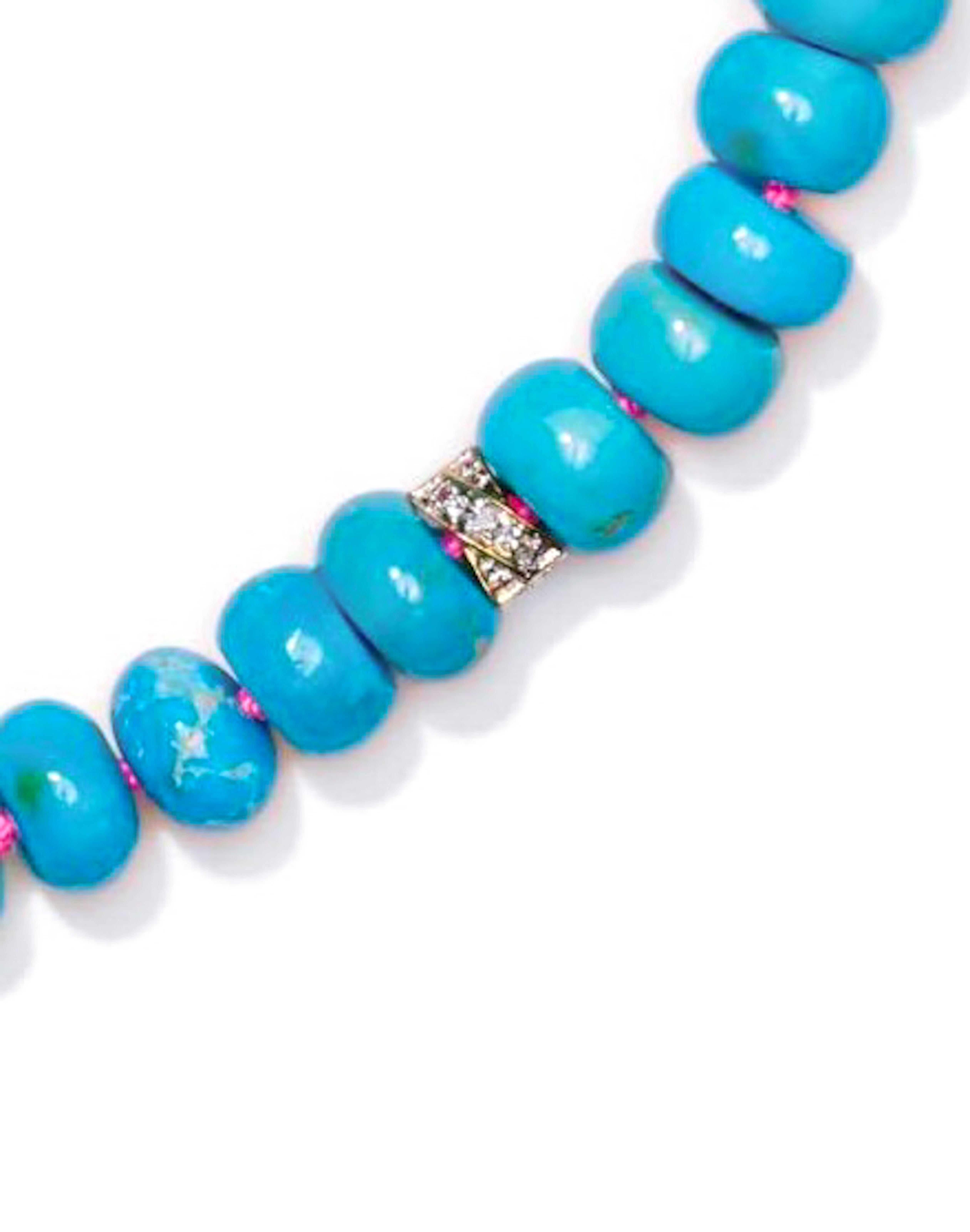 Sleeping beauty turquoise beaded necklace with diamonds in solid gold. 
The polished beads are as large as 8mm and sky blue in color. Knotted on Barbie pink silk thread. 
Finished with sparkling diamonds and a 14k Gold Clasp.

size -17 inch