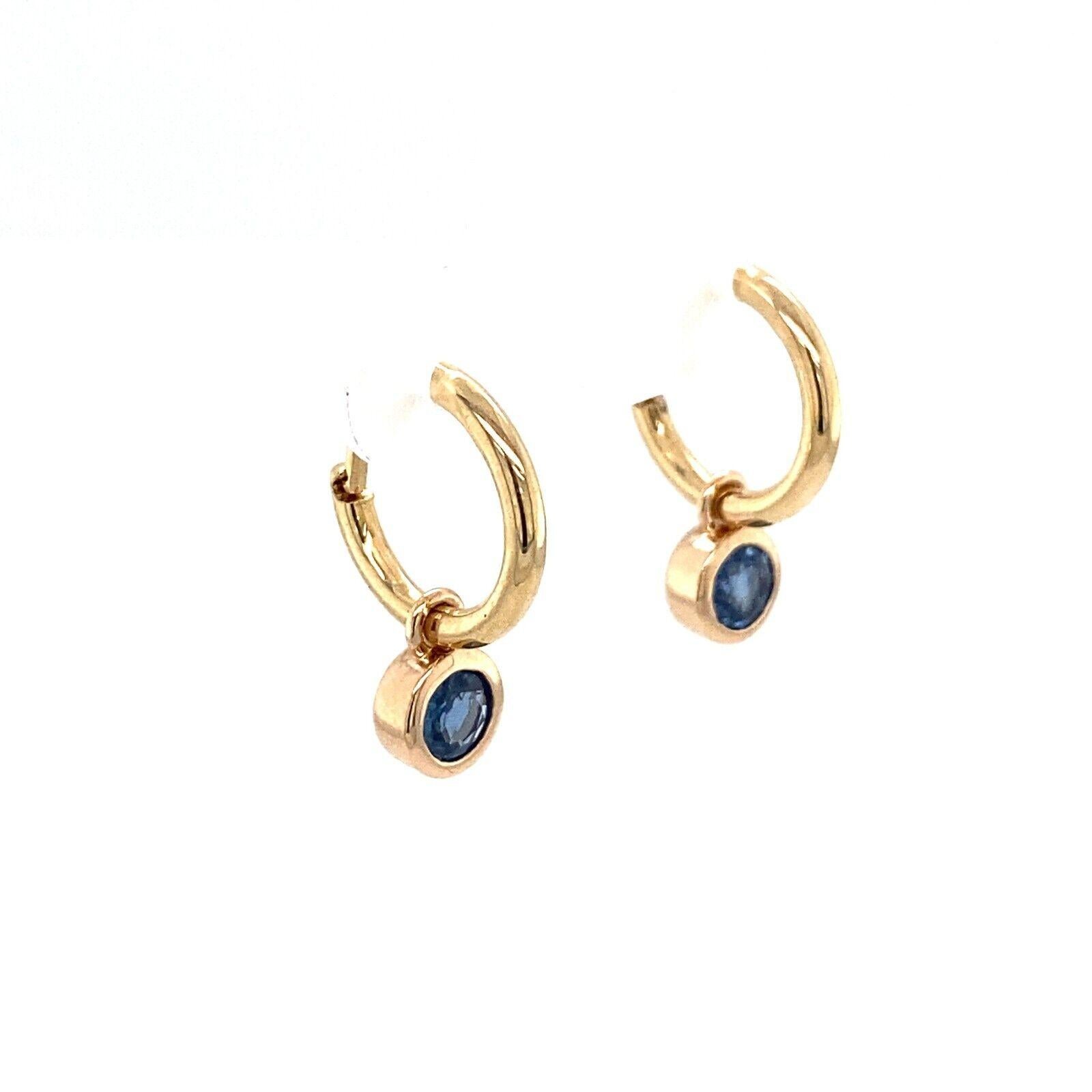 These stunning earrings are the perfect pair to add to your collection. These 14ct yellow gold hoop earrings have a total of 0.60ct round brilliant cut natural sapphires is set in a bezel setting and attached to the hoop plain earring.

Additional