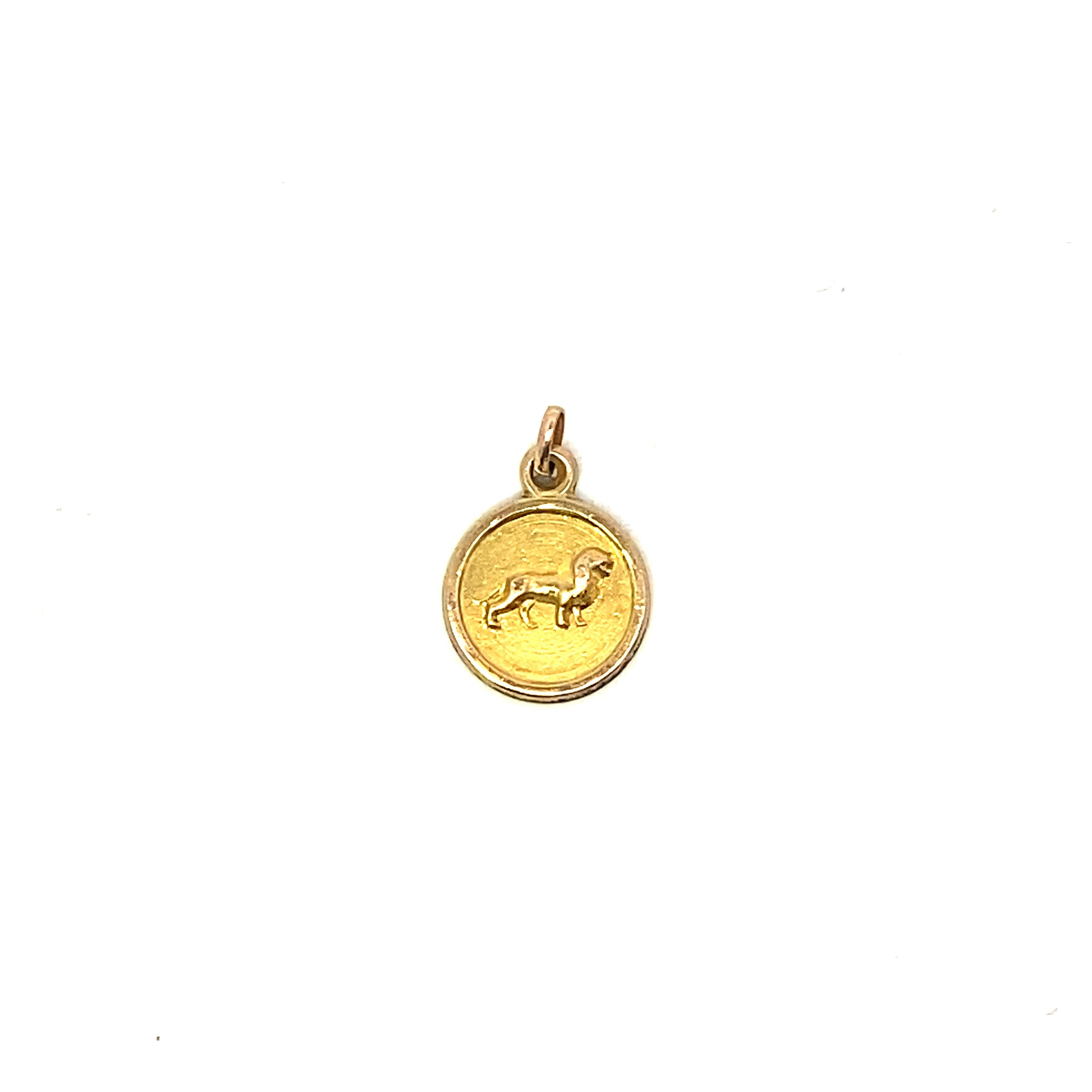 Offering our solid 14k yellow gold Leo Zodiac Charm, perfect for a necklace or charm bracelet. Measuring 0.7Dwt/1.0gm and 13mm in diameter, this dainty charm will fit any chain or charm bracelet with ease.  Charm has a small jump ring included for