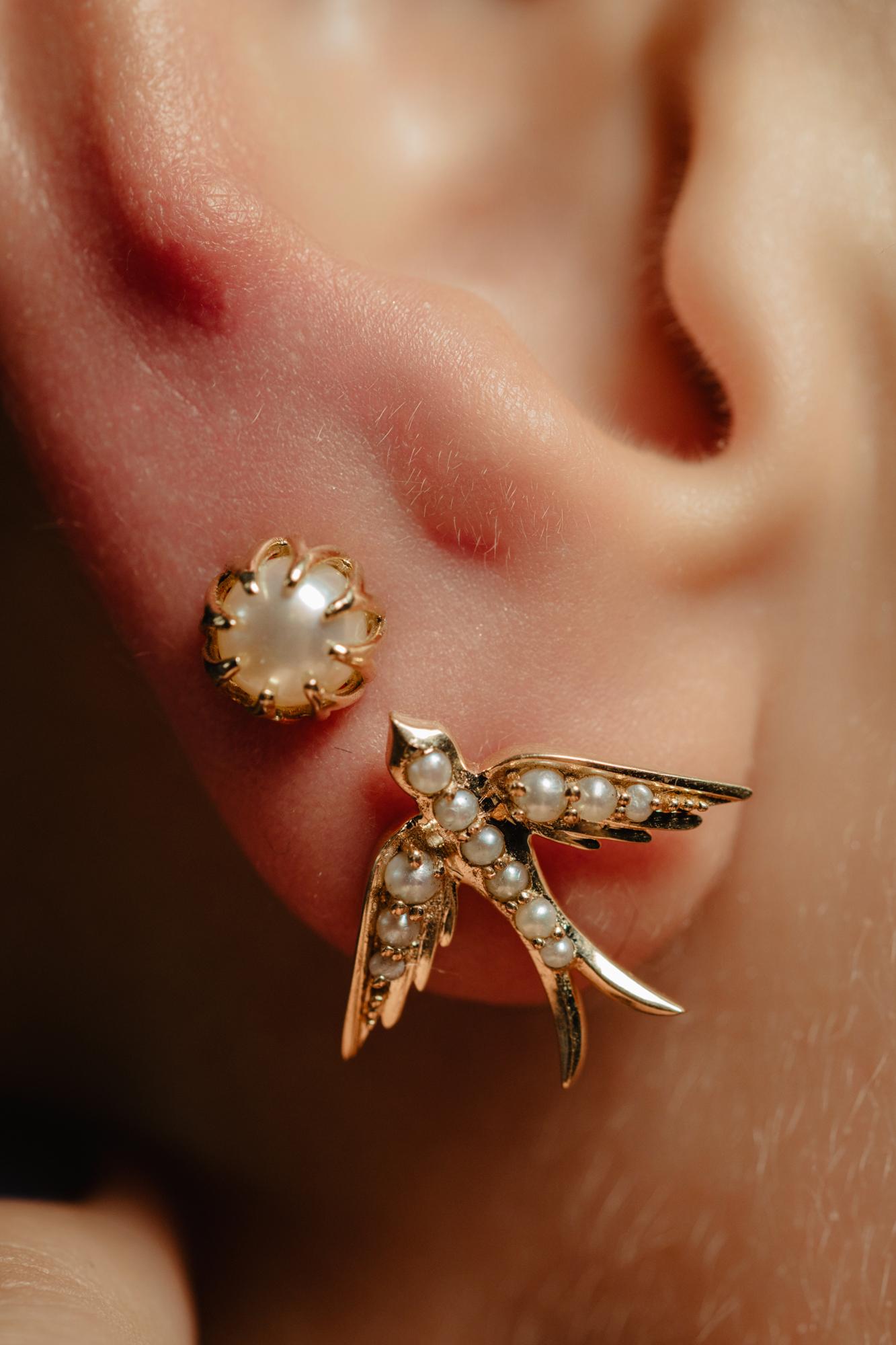 A perfect love token piece of jewelry! Romantic and very symbolic this antique revival stud is handmade by our goldsmiths. Made of solid 14k yellow gold, these beautiful Victorian style swallow earring is set with natural pearls.

The design of this
