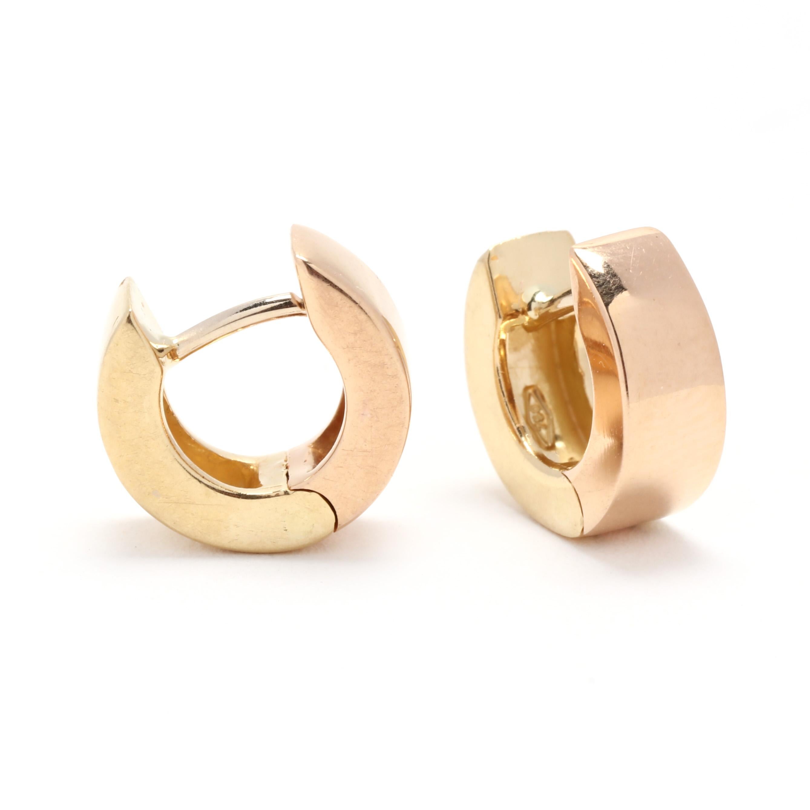 A pair of vintage 18 karat bi color gold wide huggie hoop earrings. These solid gold huggie hoops feature a squared off motif with one side in yellow gold, the other in rose gold and with pierced snap closures.

Inner Diameter: 7 mm

Width: 4.85