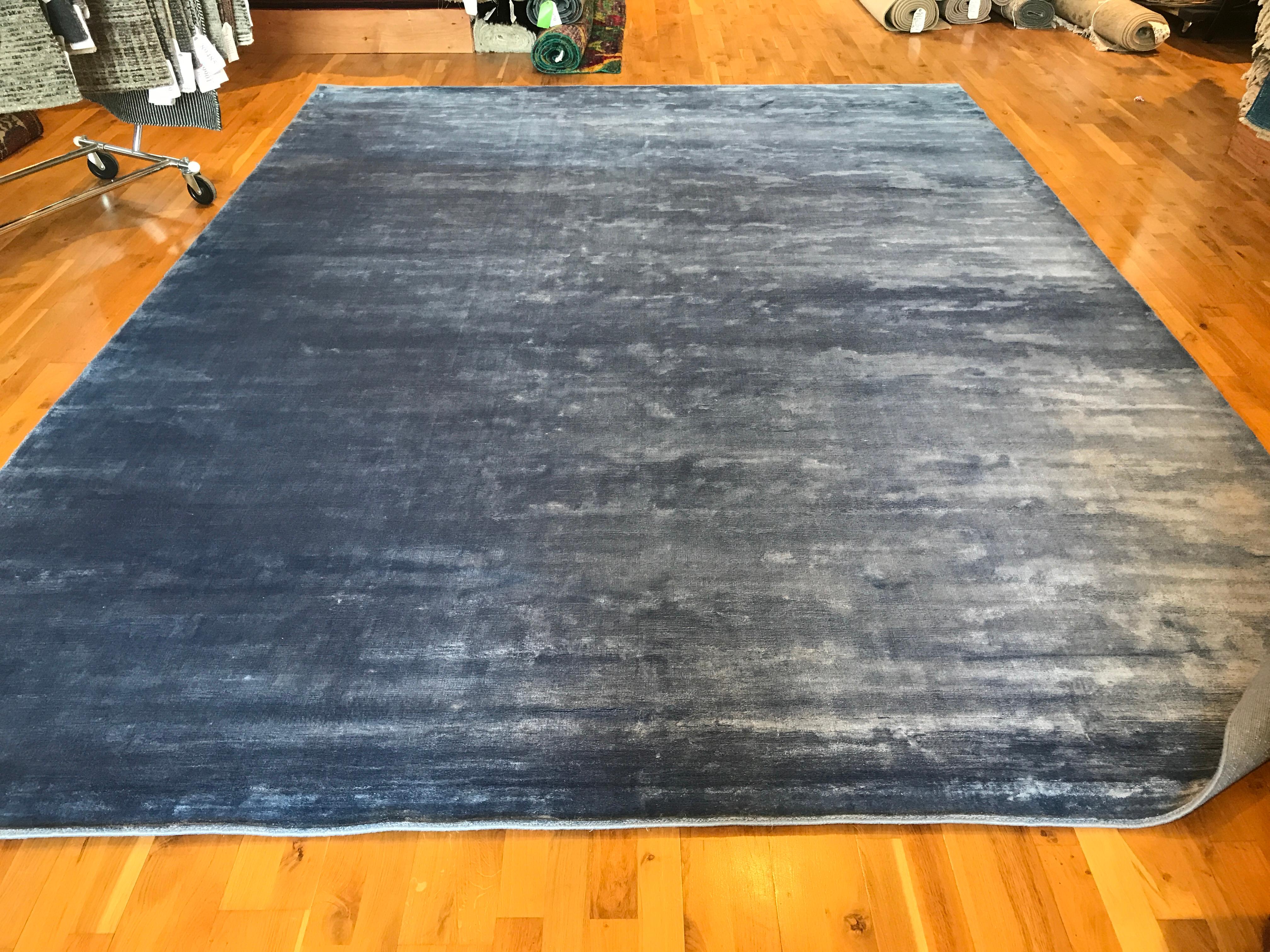 Solid blue grey rug.
