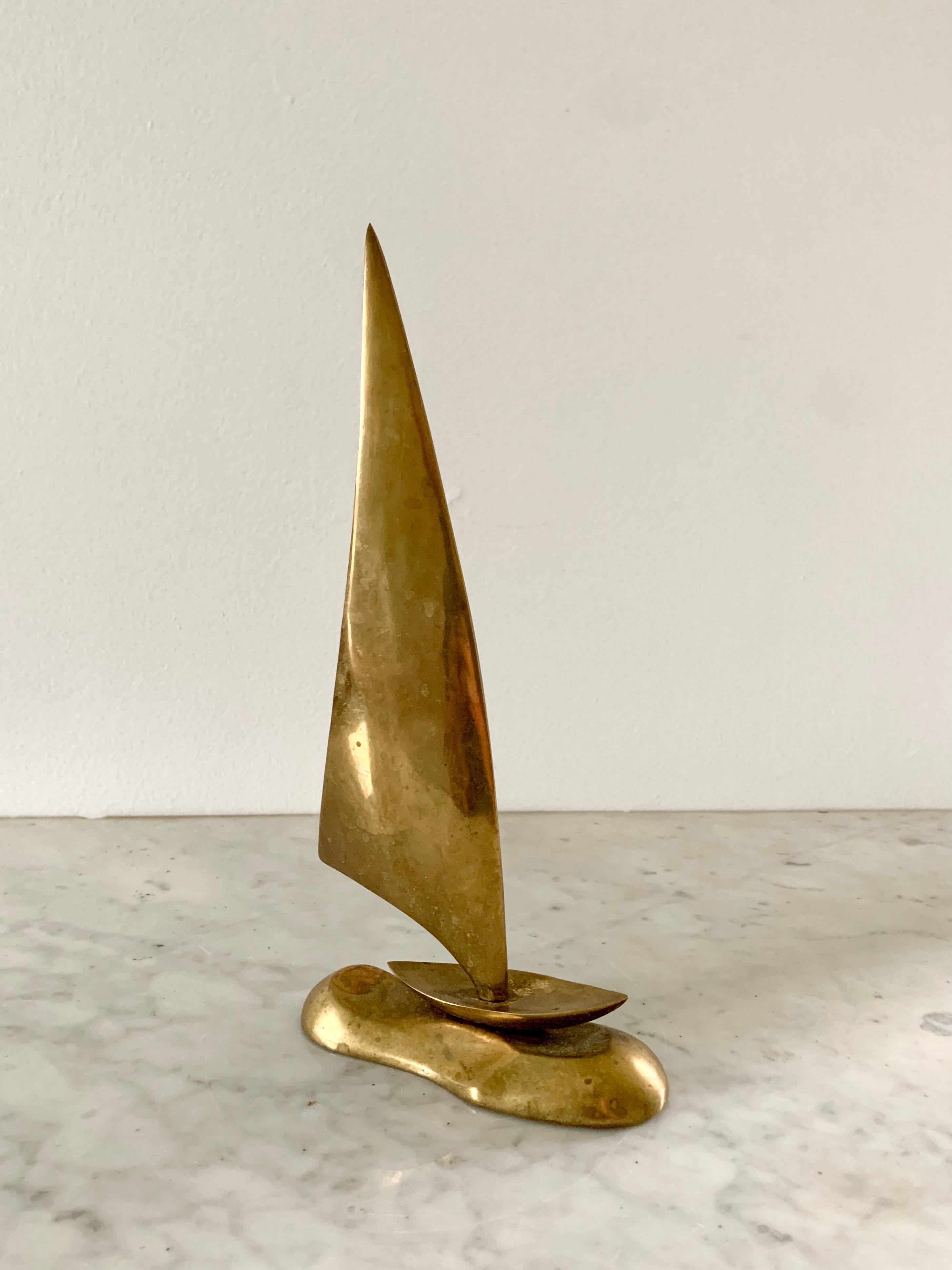 A charming cast solid brass sailboat

USA, Circa 1960s

Measures: 5.13