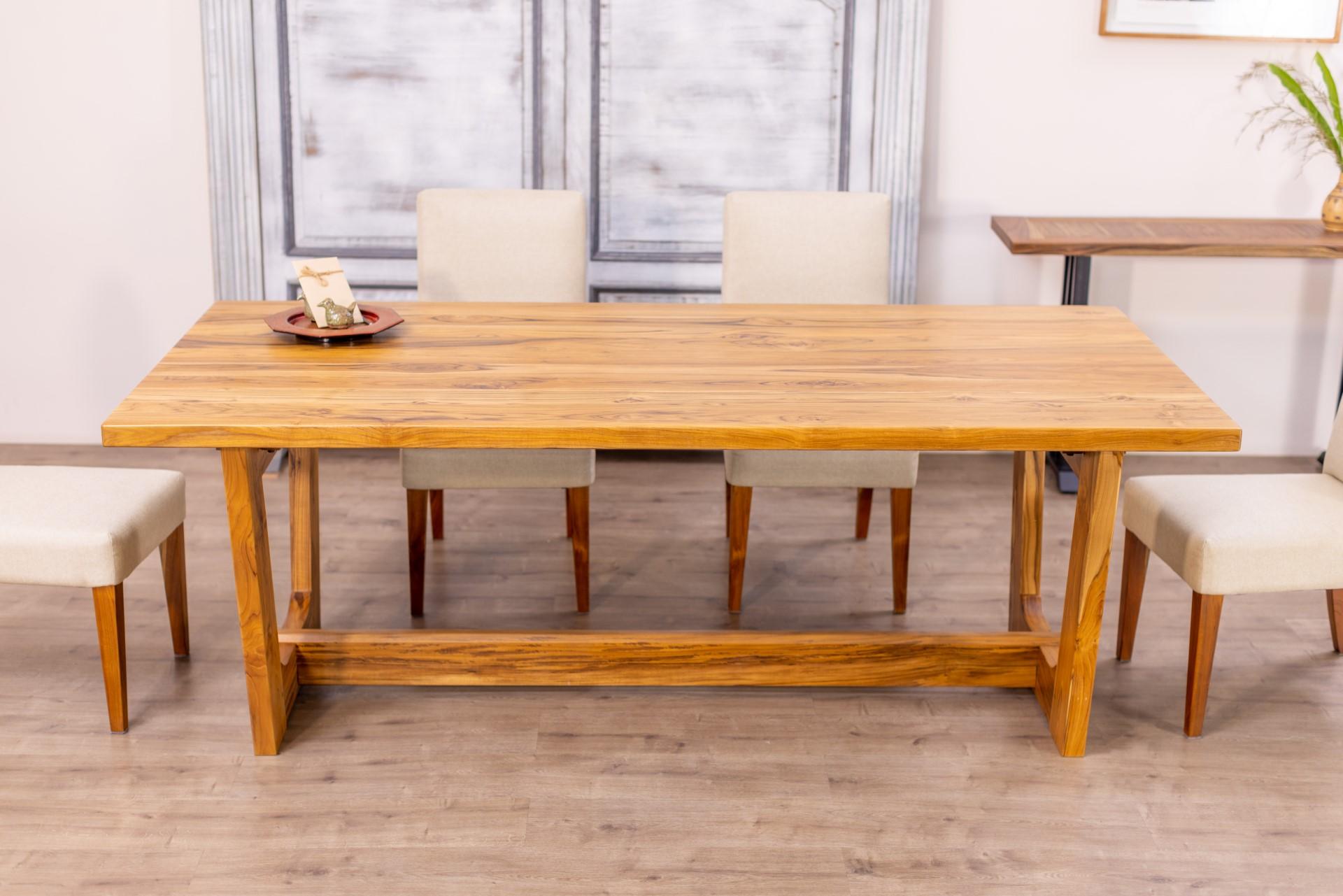 This 100% solid hardwood dining table exudes sophisticated, traditional style with a contemporary twist. The beautiful, solid oak or teak top spans to reveal gorgeous hand-finished wood grain and texture. Stabilized with a crossbeam that highlights