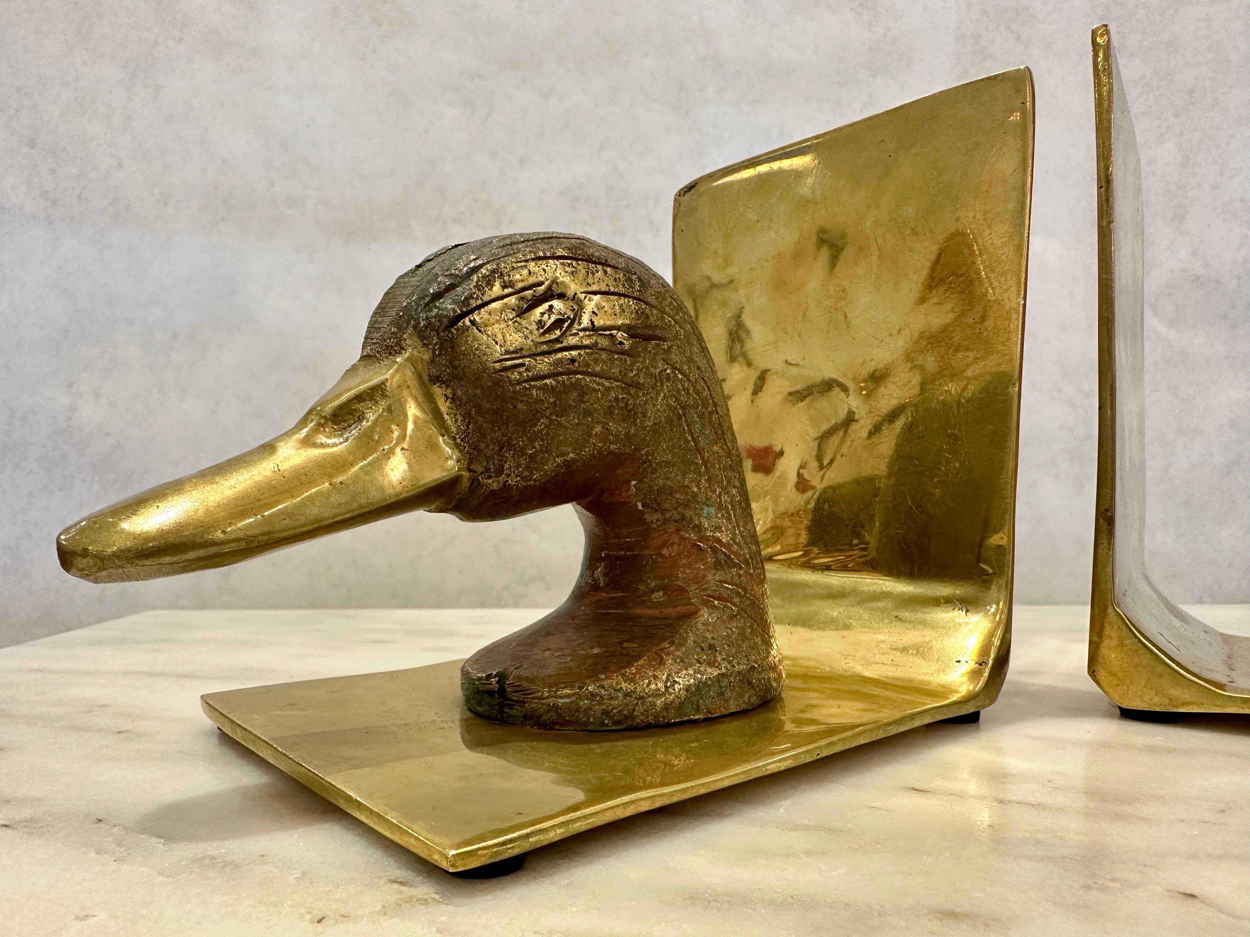 These vintage heavy brass Mallard head bookends show a wonderful patina from age and use.  One panel is slightly taller than the other ( see detail images).   THIS ITEM IS LOCATED AND WILL SHIP FROM OUR MIAMI, FLORIDA SHOWROOM.