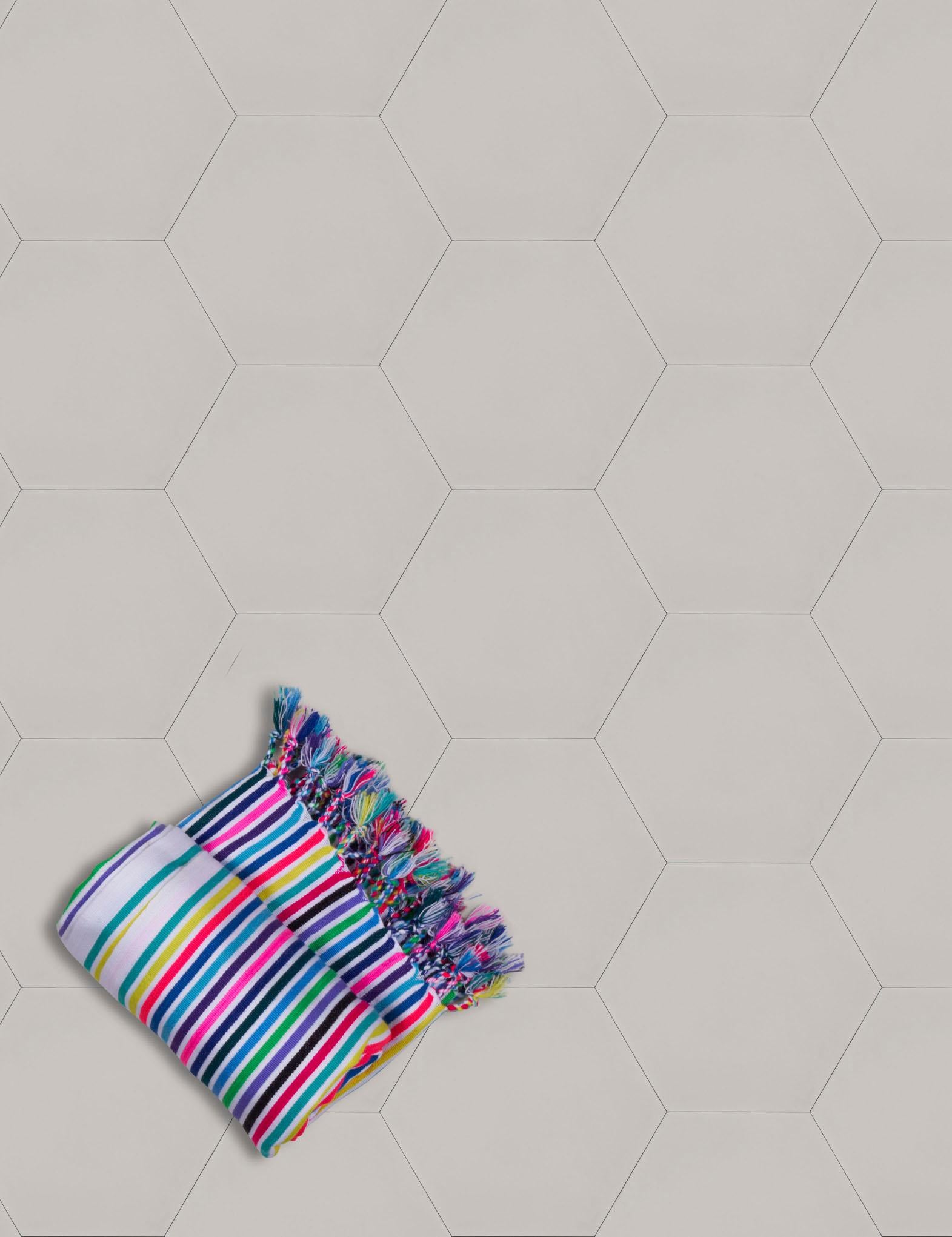 Available in our full palette in both cement and ceramic tile, these solid-shade hexagonal tiles can stand alone or mix with other colors to create a multicolor surface. They can also be coordinated with our Moon Phase tiles for a calming mix of