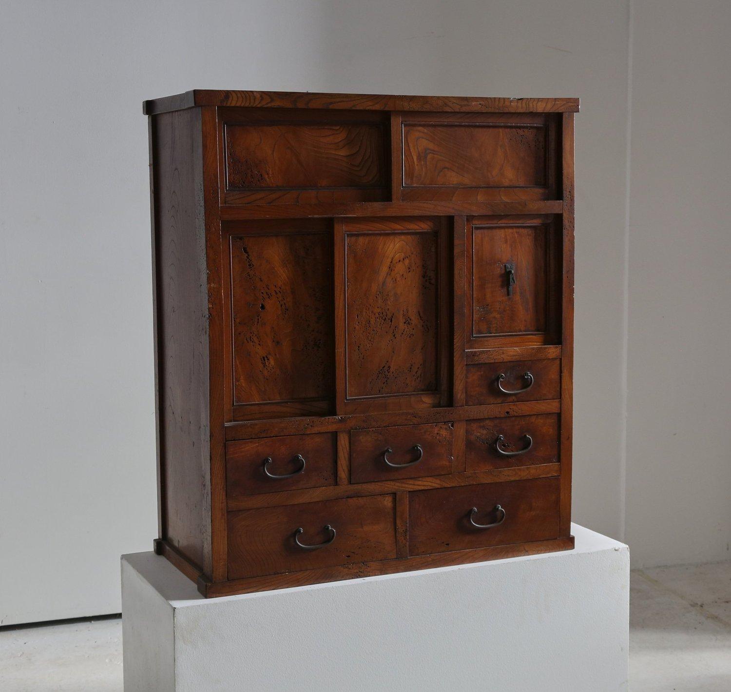 Early Twentieth Century Elm Burlwood Japanese cabinet.  

Constructed entirely of solid elm burlwood. Iron forged handles, blacksmith made. 

Very fine detailing and is incredibly well-made. Excellent grain pattern throughout. A rare usage of